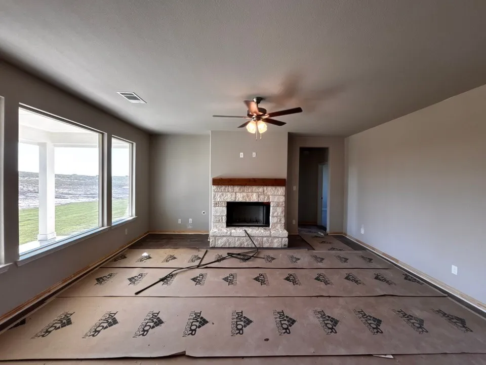 Stone fireplace with a wood mantel