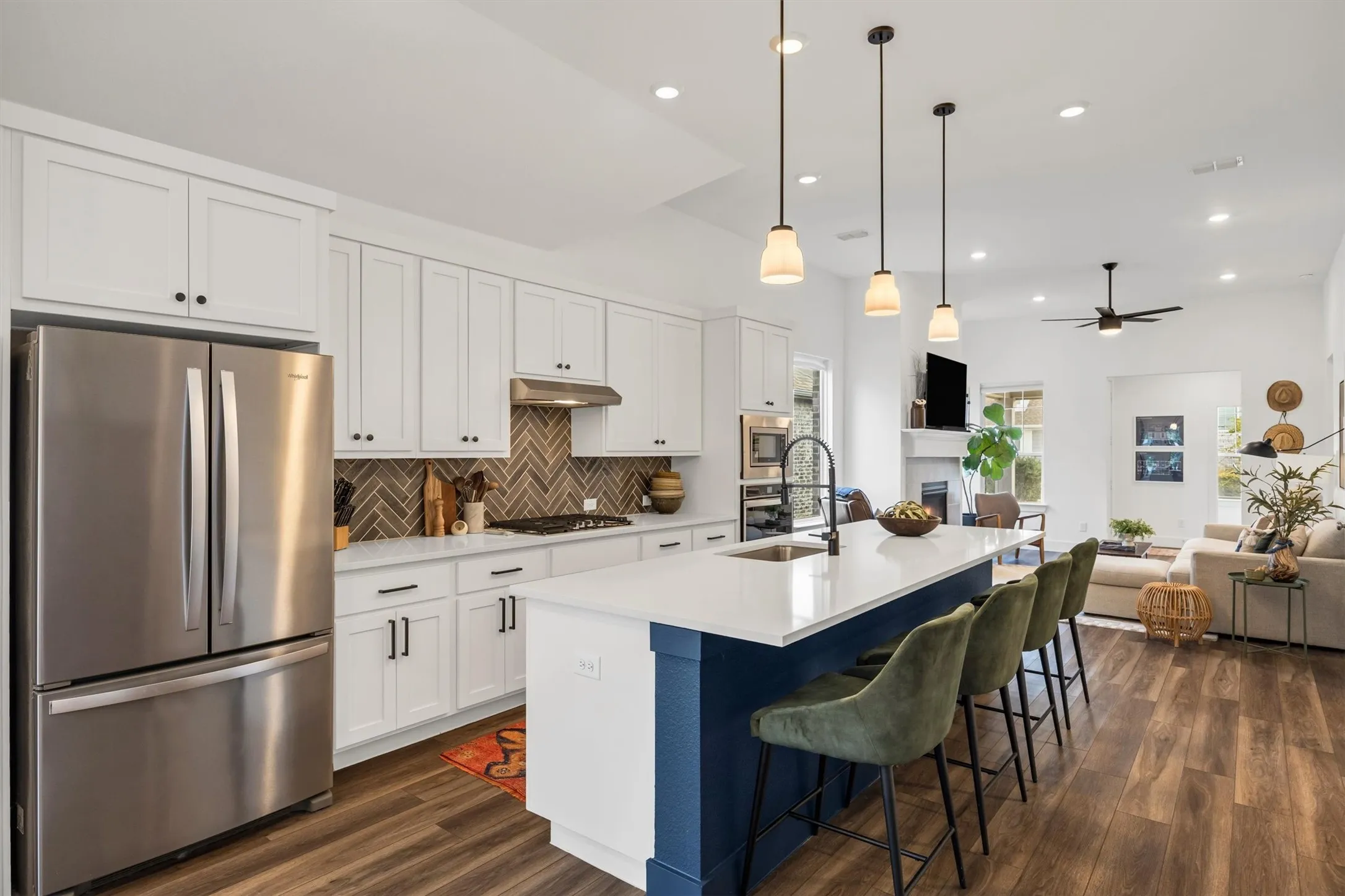 Open-concept living space with wood-finish flooring