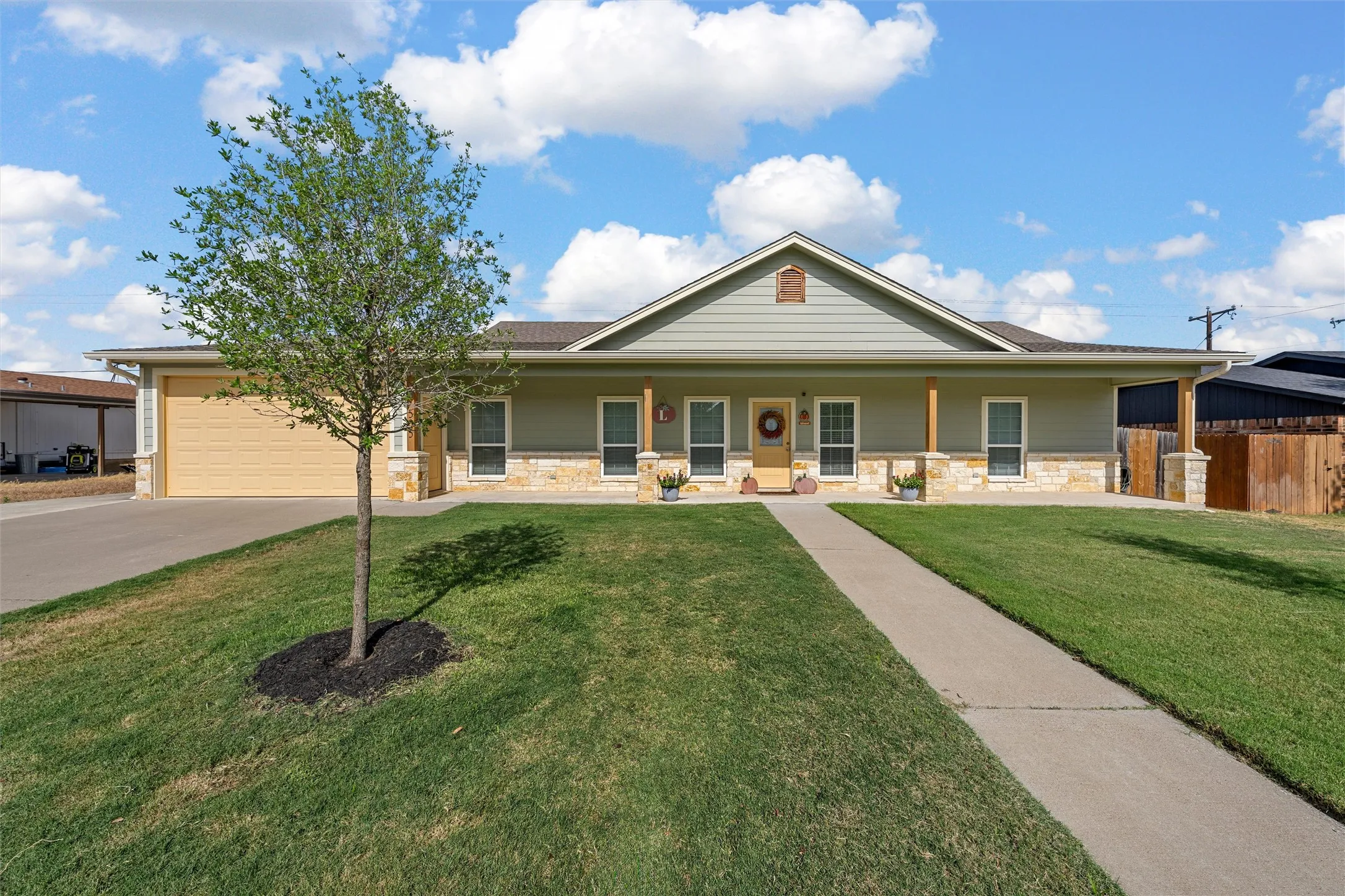 Spacious front yard with a paved walkway