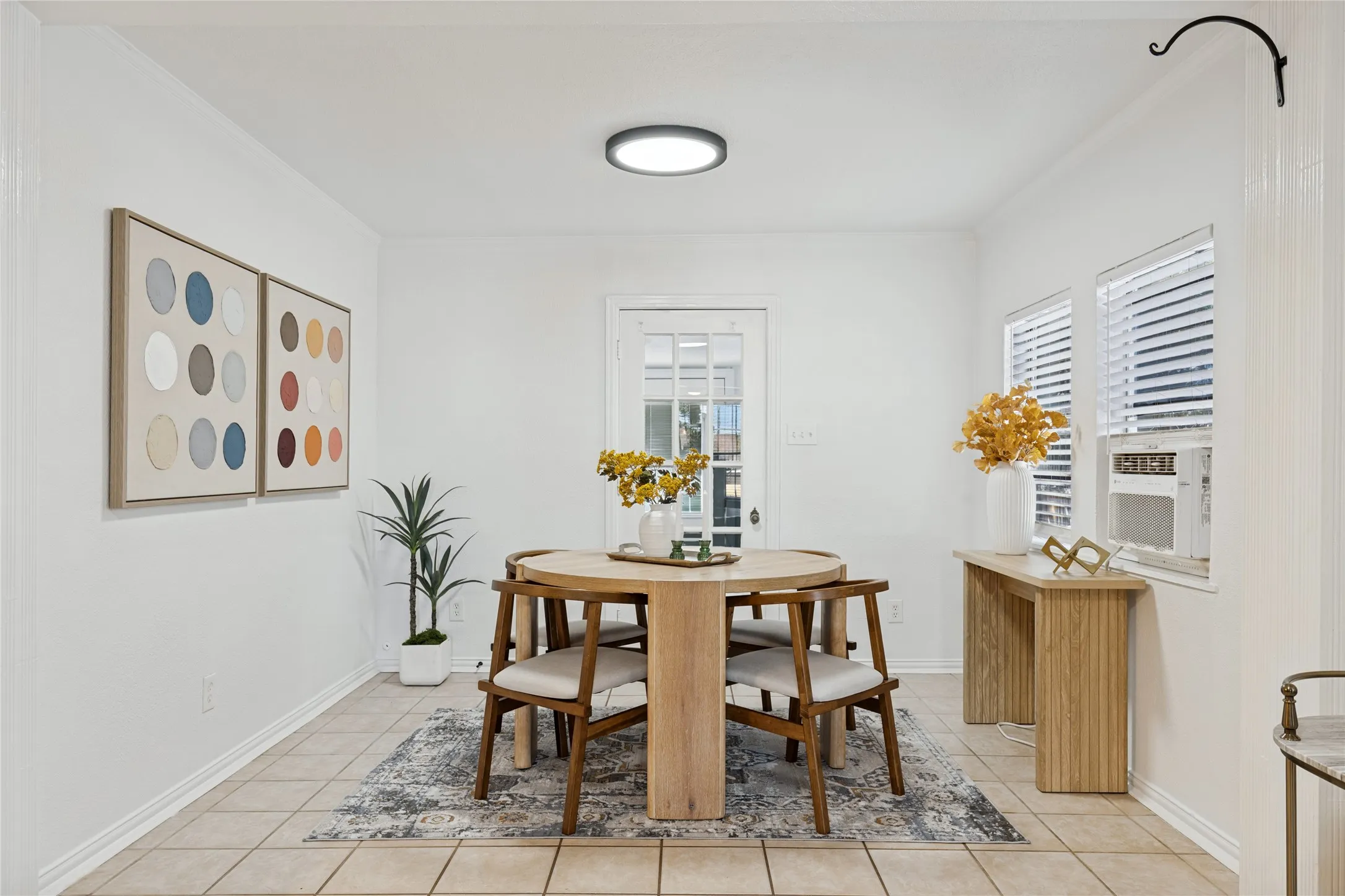 Tile flooring, white walls, recessed lighting, white window blinds, and a rear door with glass panels