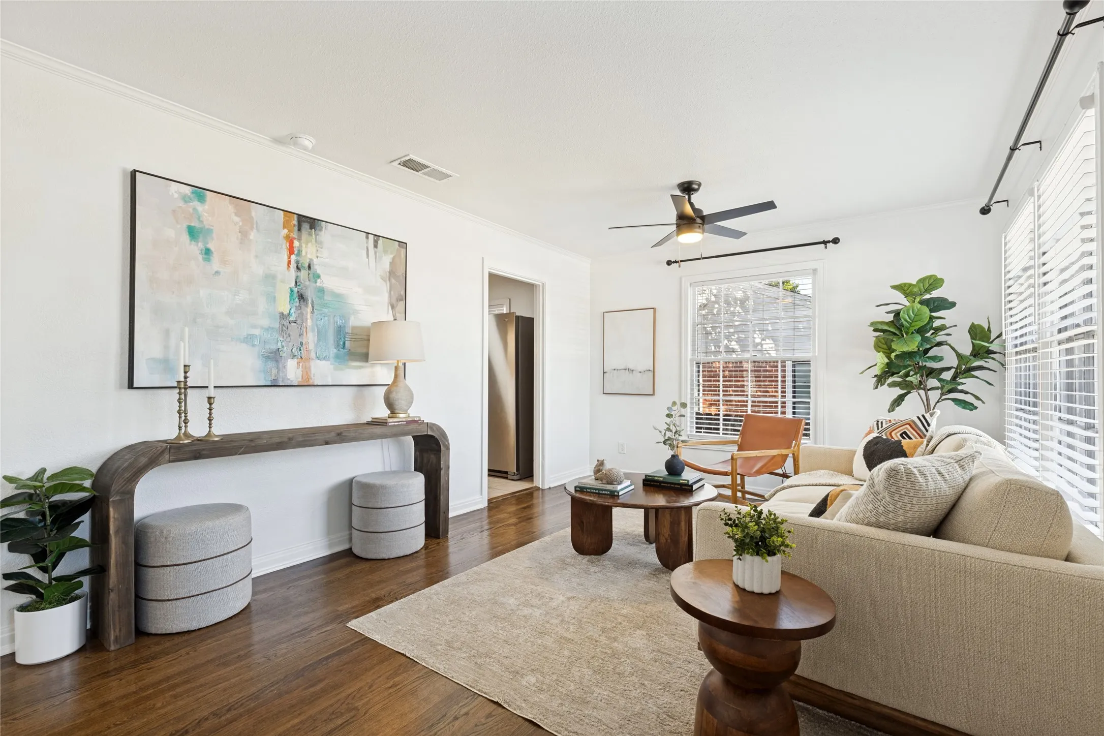 Hardwood flooring, crown molding, ceiling fan, white window blinds, and recessed lighting