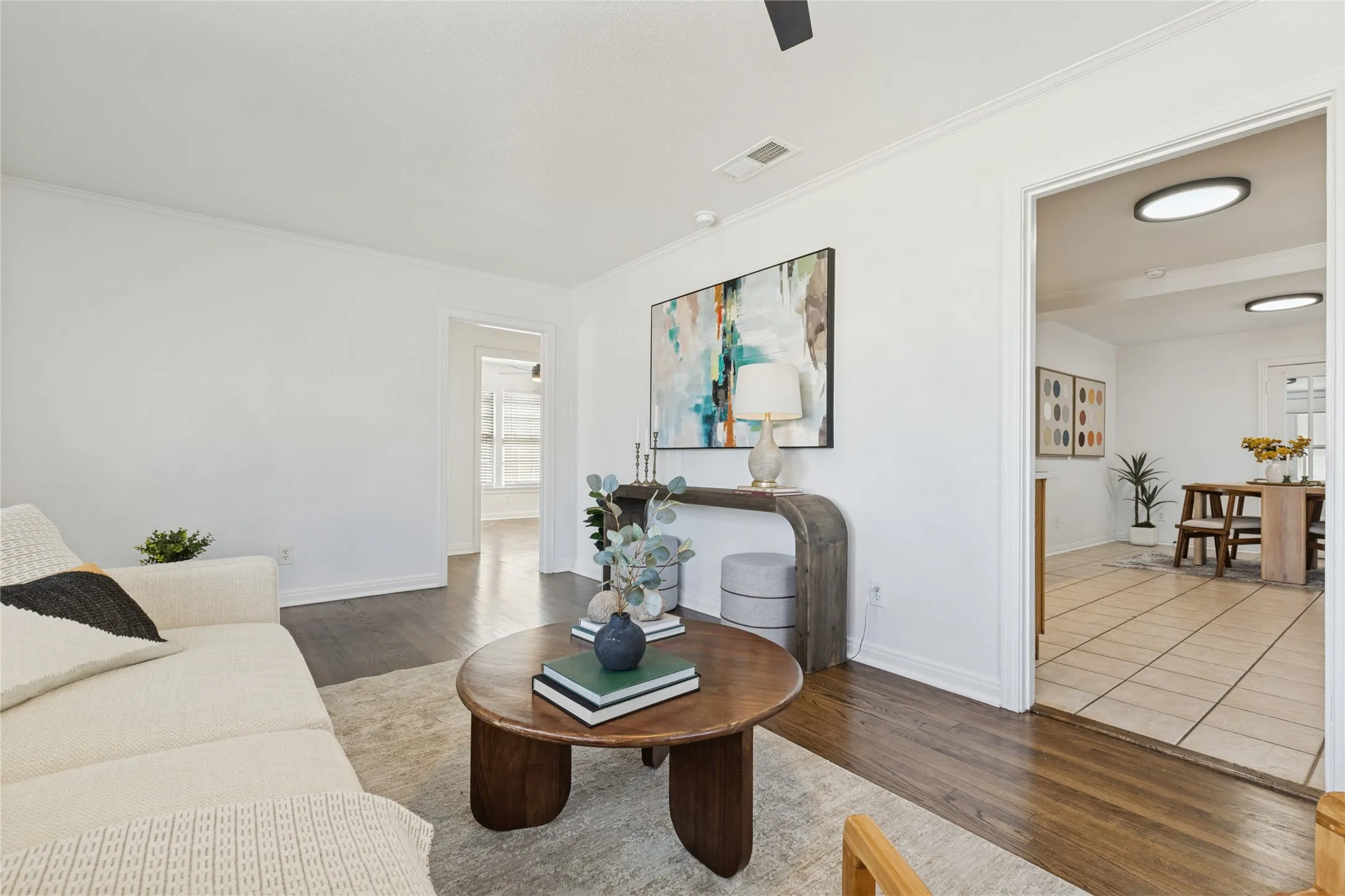 Hardwood-finish flooring, recessed lighting, and a white ceiling fan