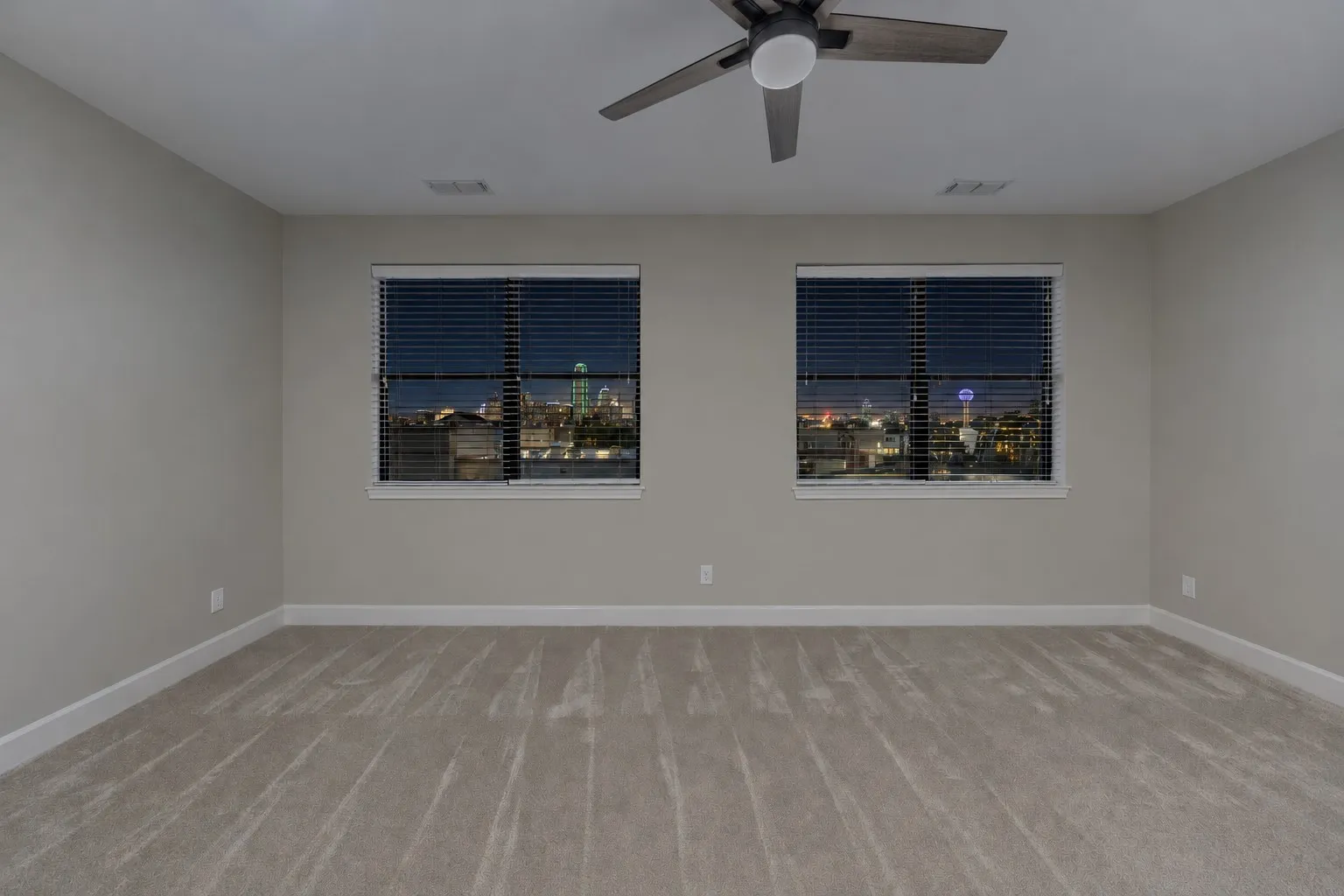 Primary bedroom with skyline view