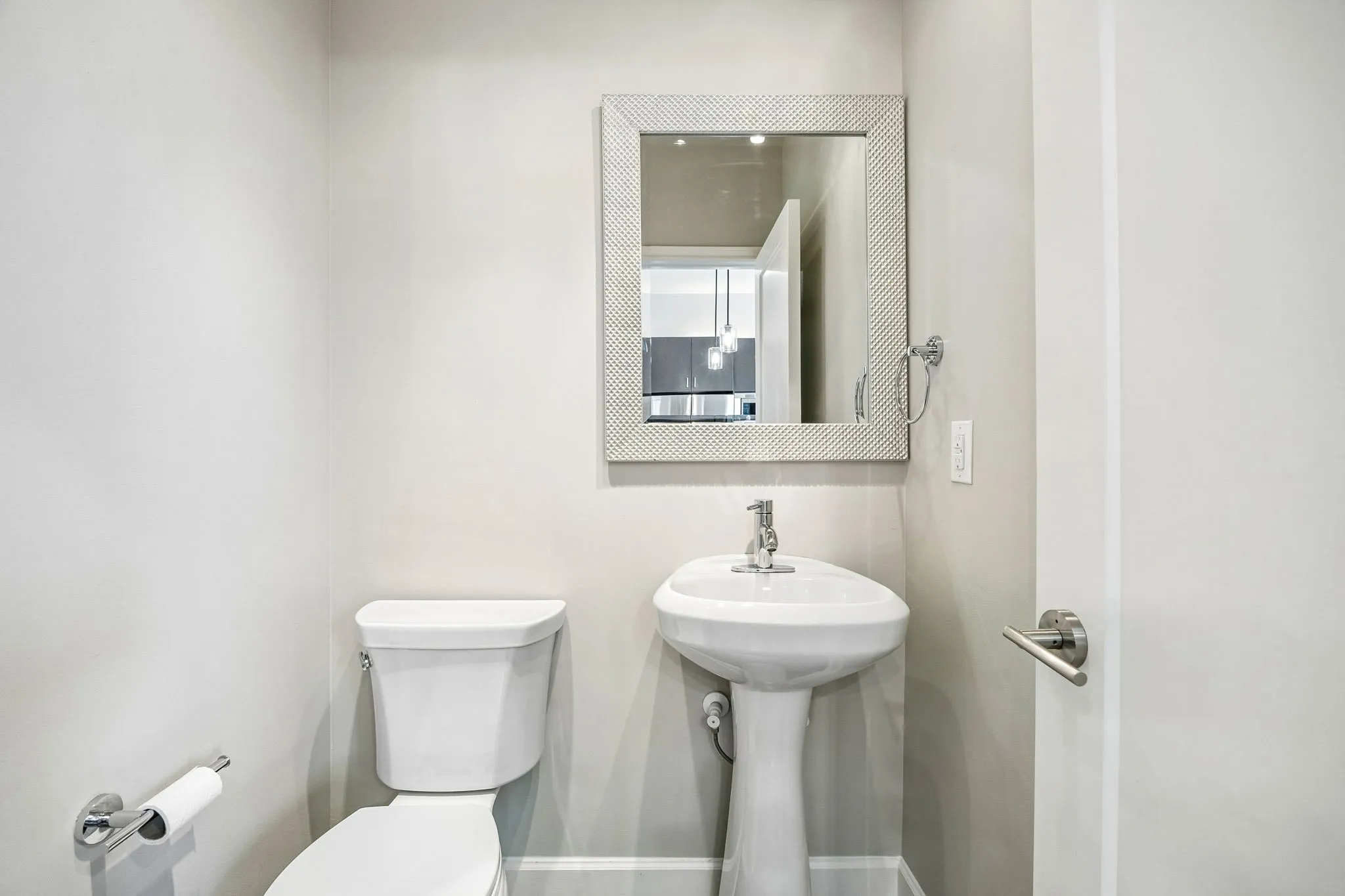 Half bathroom off kitchen and living room