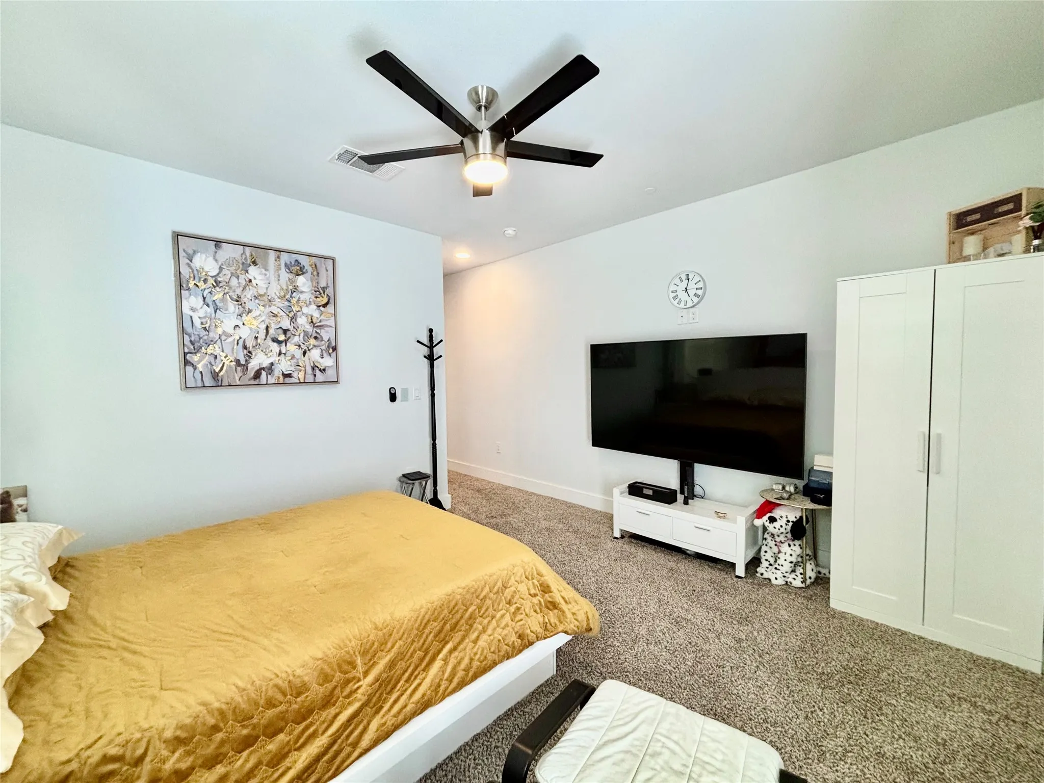 Carpeted flooring, recessed lighting, and a ceiling fan with light fixture