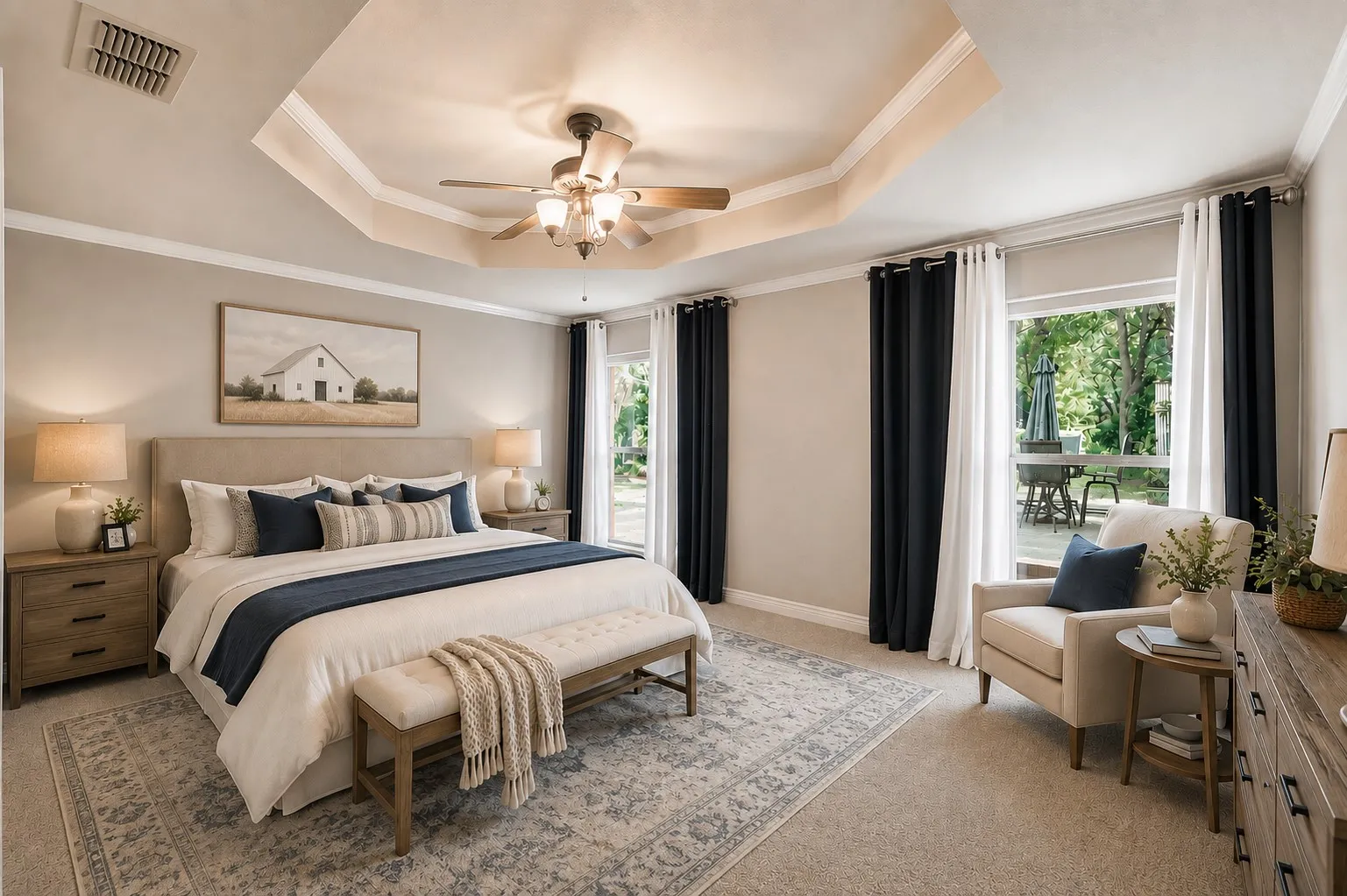 Primary bedroom with trey ceilings