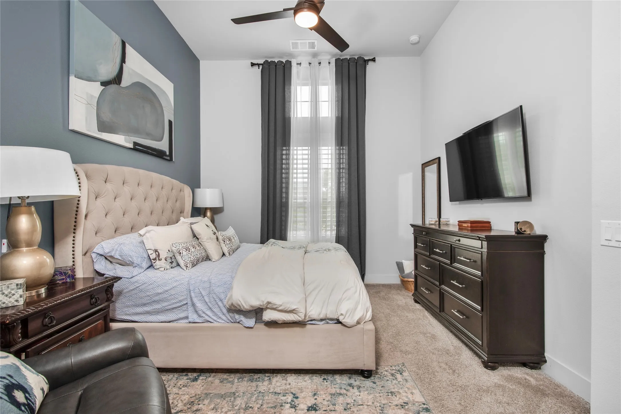 Recessed lighting, ceiling fan with integrated light, high ceilings, carpeted flooring, and window with blinds and drapes