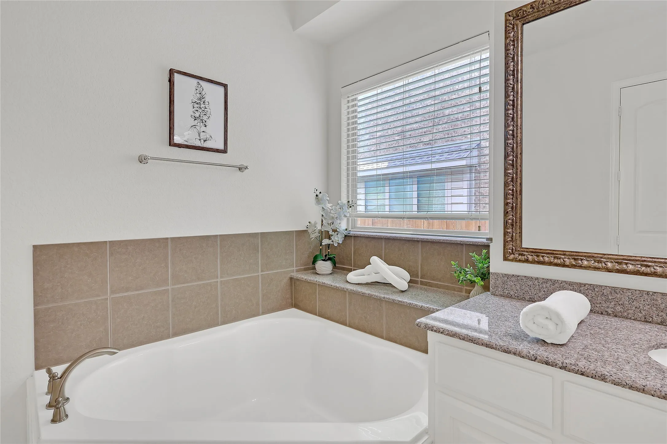 Bathroom with a bath and vanity