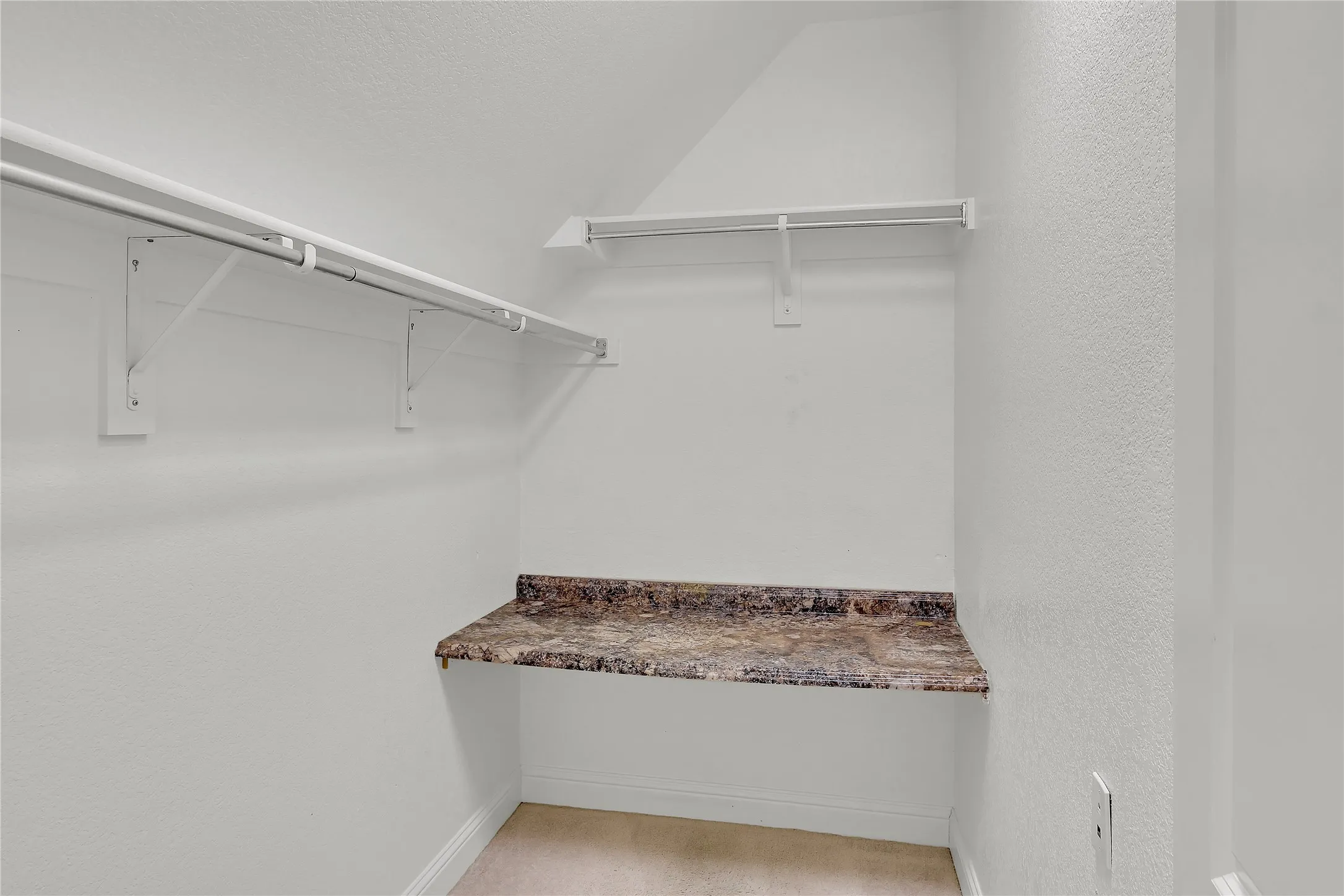 Spacious closet featuring lofted ceiling