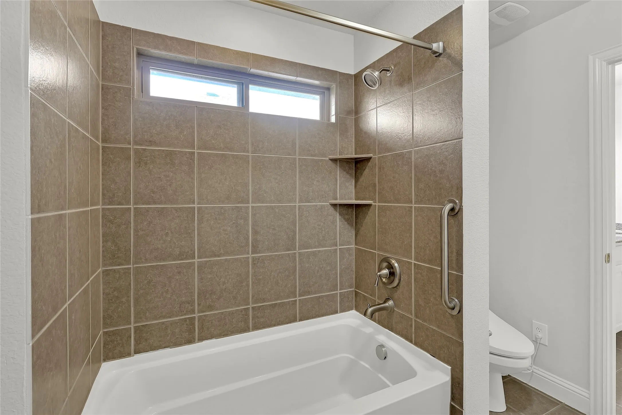 Full bath with toilet and  shower combination