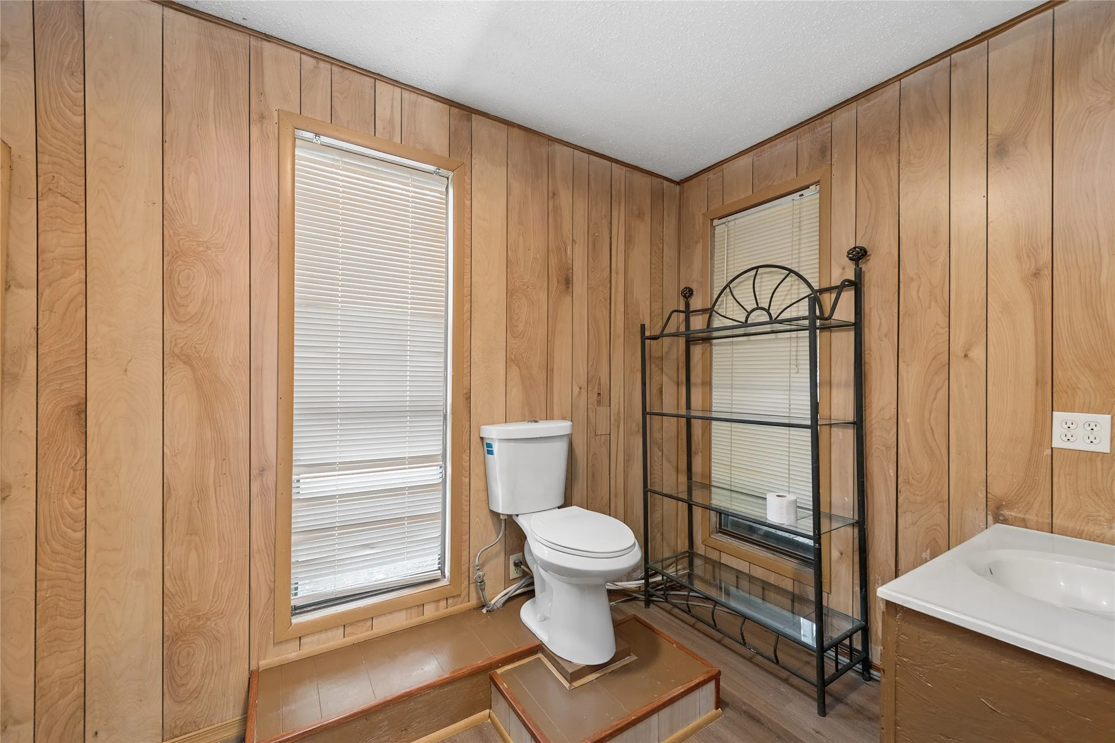 Paneling walls with wood-finish flooring