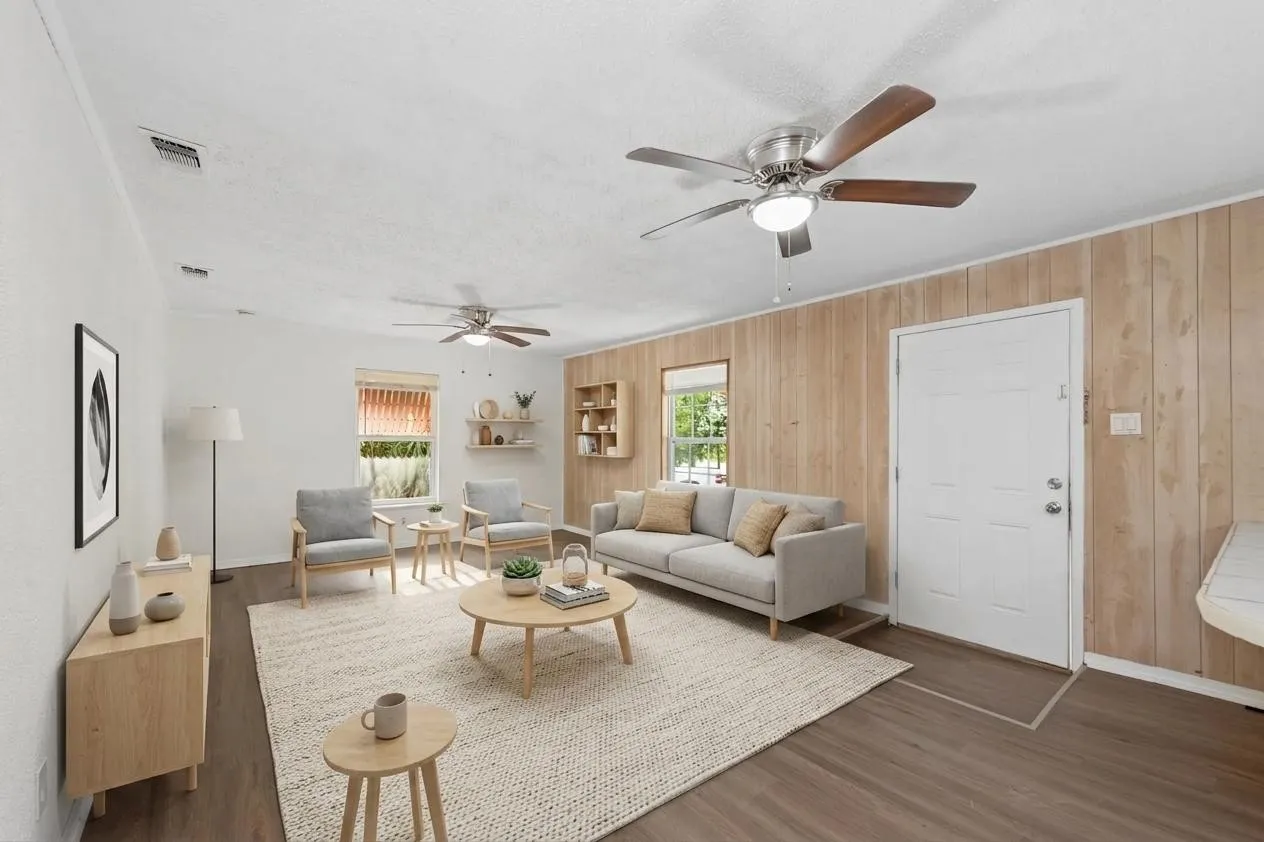 Wood-finish flooring throughout, complemented by a white paneled door