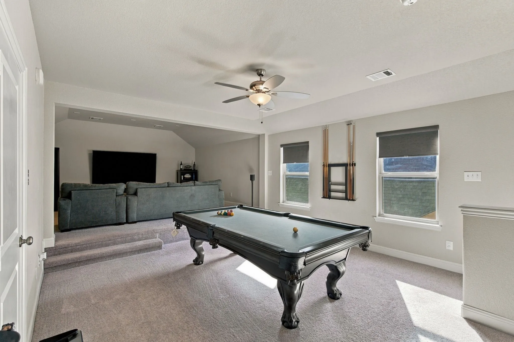 Upstairs game room and media area.