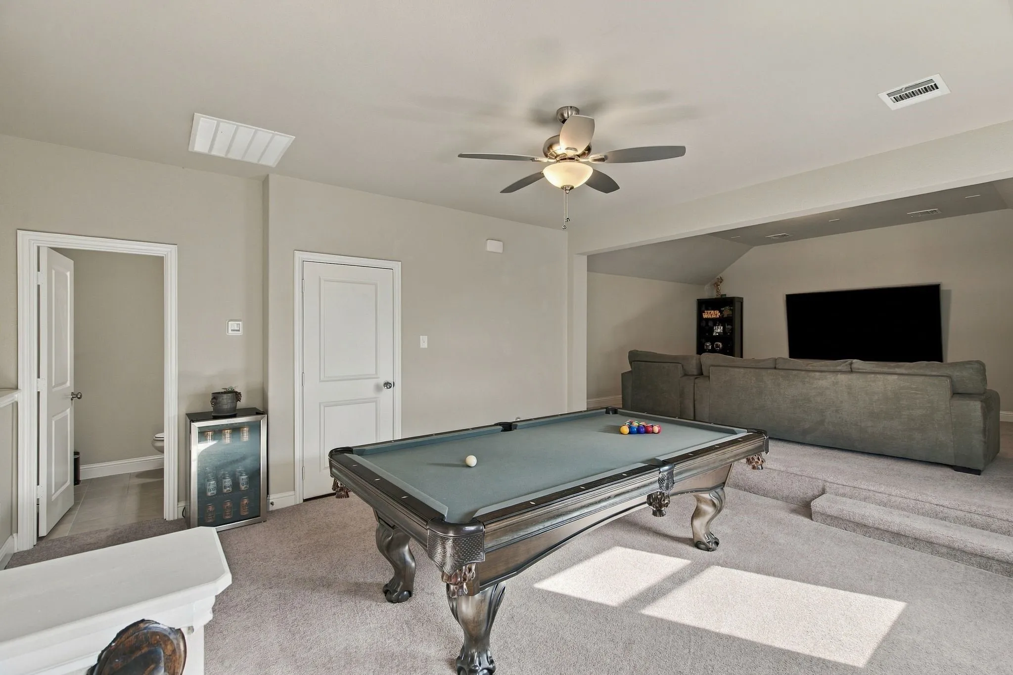 Upstairs game room and media area.