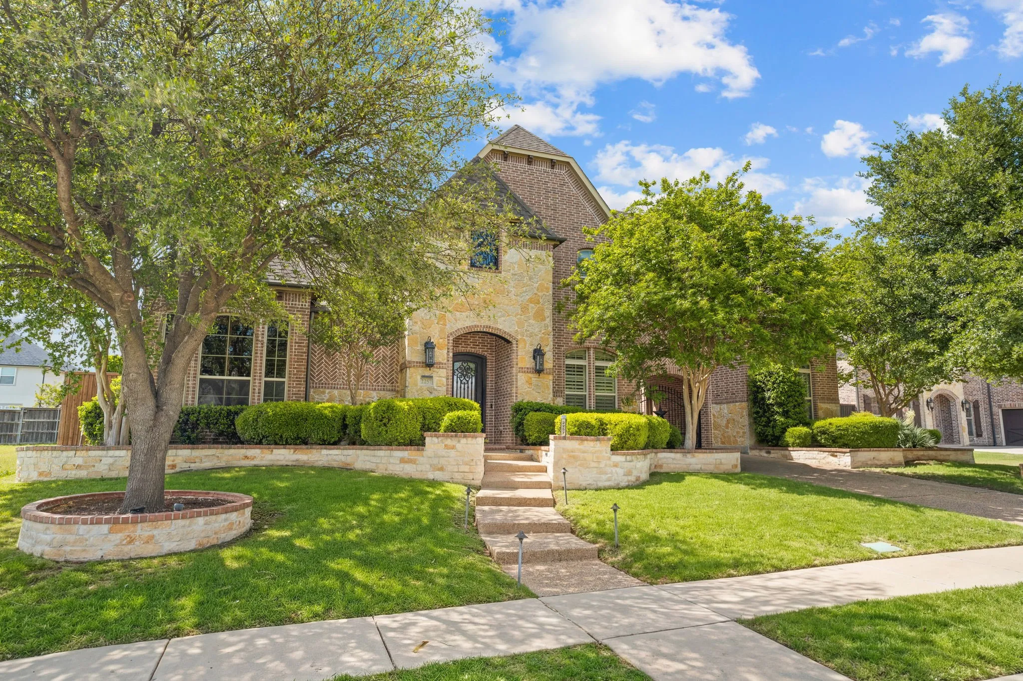 This popular porte cochere plan offers a sense of grandeur & hospitality. Lush landscaping adds to the stunning curb appeal with a gated, split 3-car garage on a corner lot. Quality craftsmanship with many updates by this original owner.