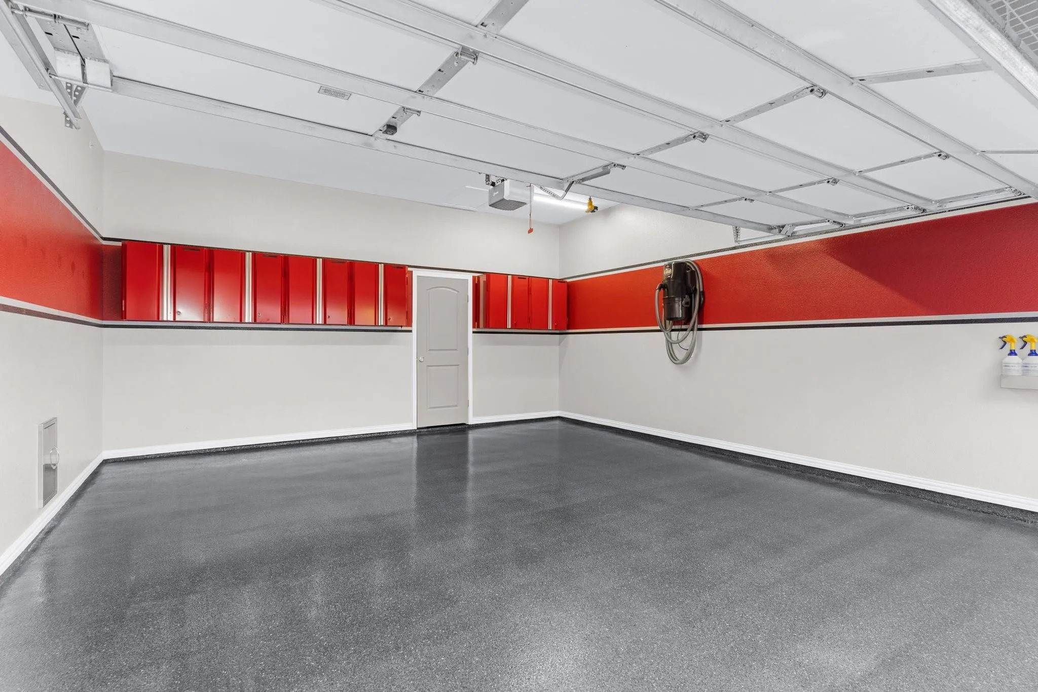 Car enthusiasts will LOVE this sleek 2-car garage designed by the seller with both style & function in mind. Custom cabinets, epoxy floor, LED lighting elevate this space! Single-car garage has epoxy flooring too.