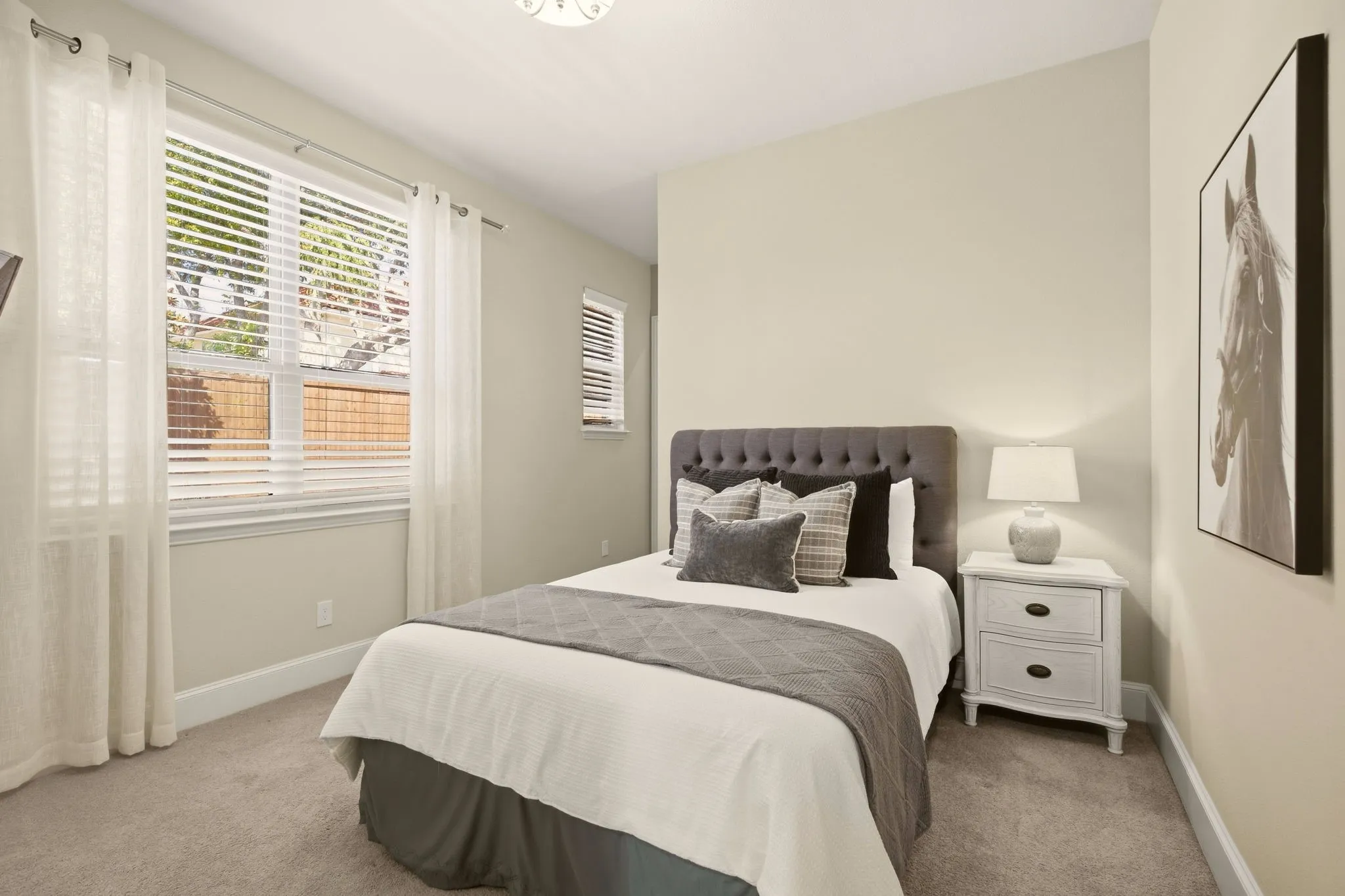 Guest suite on the first floor faces the backyard pool. Full bath is located to the left...walk-in closet to the right.