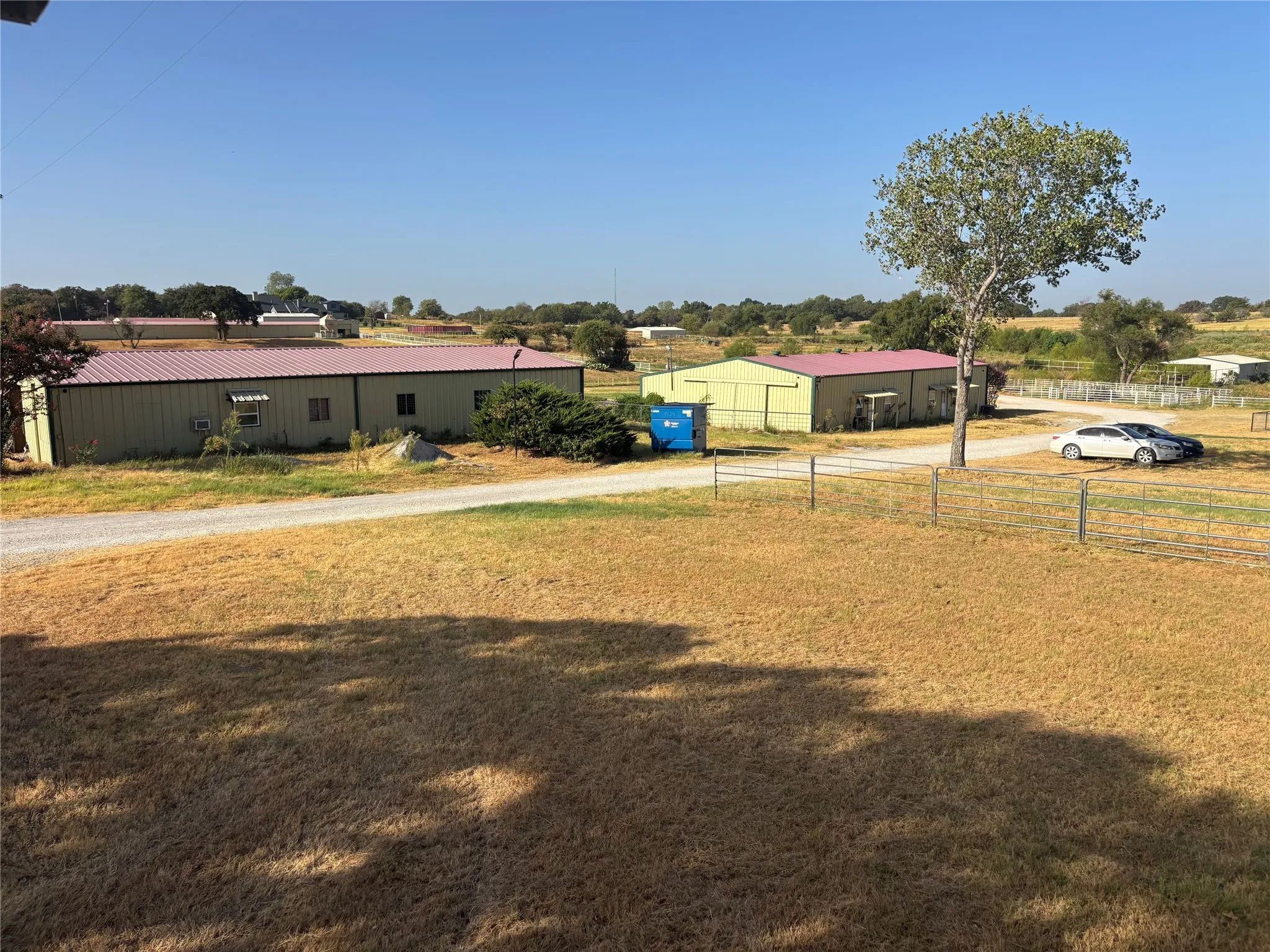 Multiple metal-sided structures with red roofs