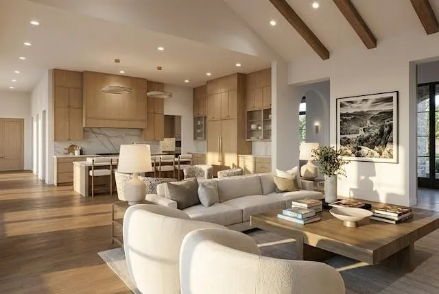 Open-concept living space featuring wood-finish flooring and vaulted ceilings with exposed beams