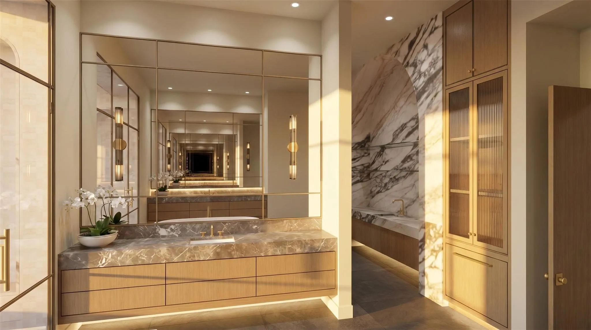 Dual vanity with stone countertop and integrated sinks, extensive built-in cabinetry, full-height mirror wall with grid detailing, and stone archway