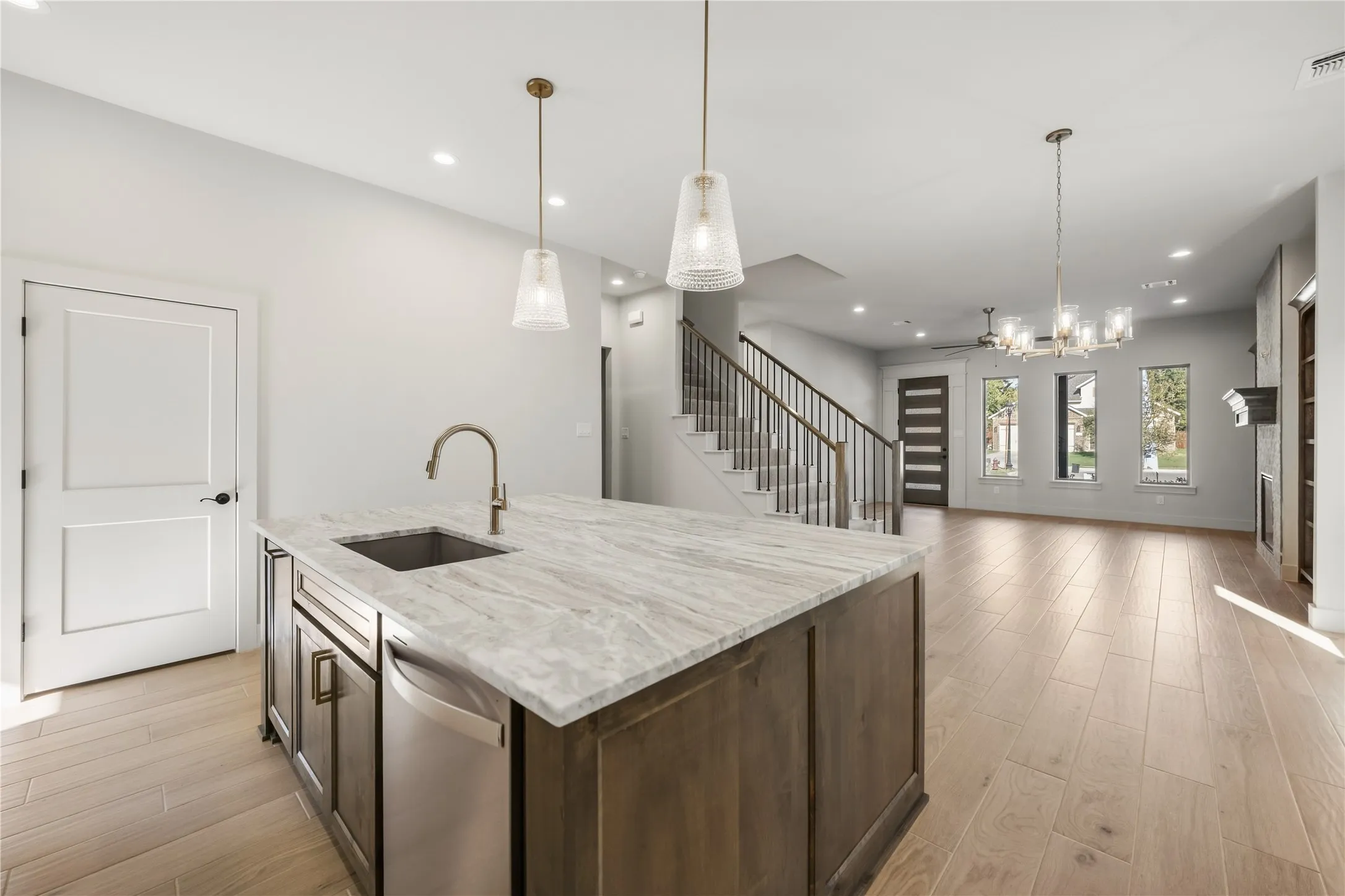 Kitchen island with integrated sink and stainless steel dishwasher