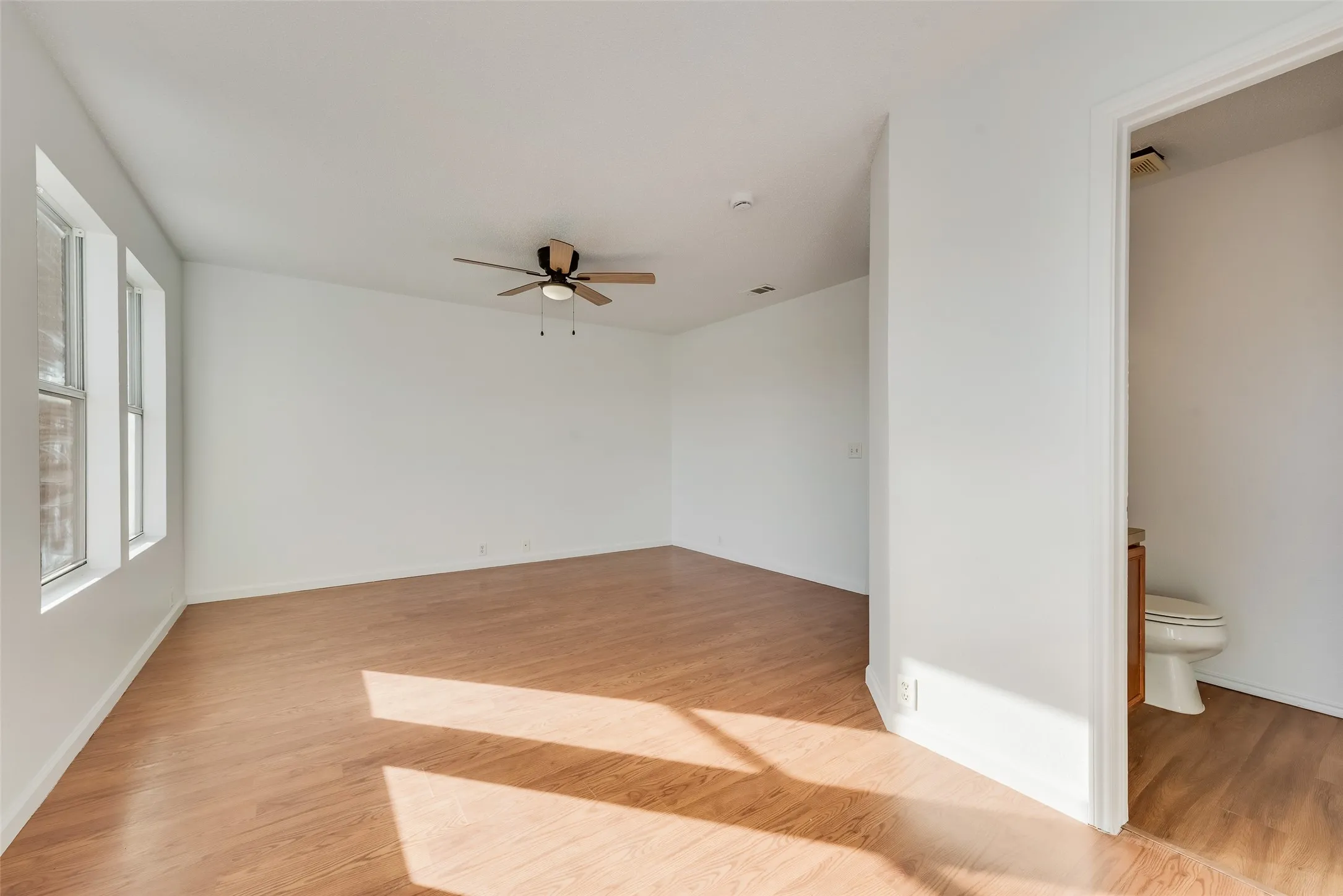 Wood-finish flooring with white walls