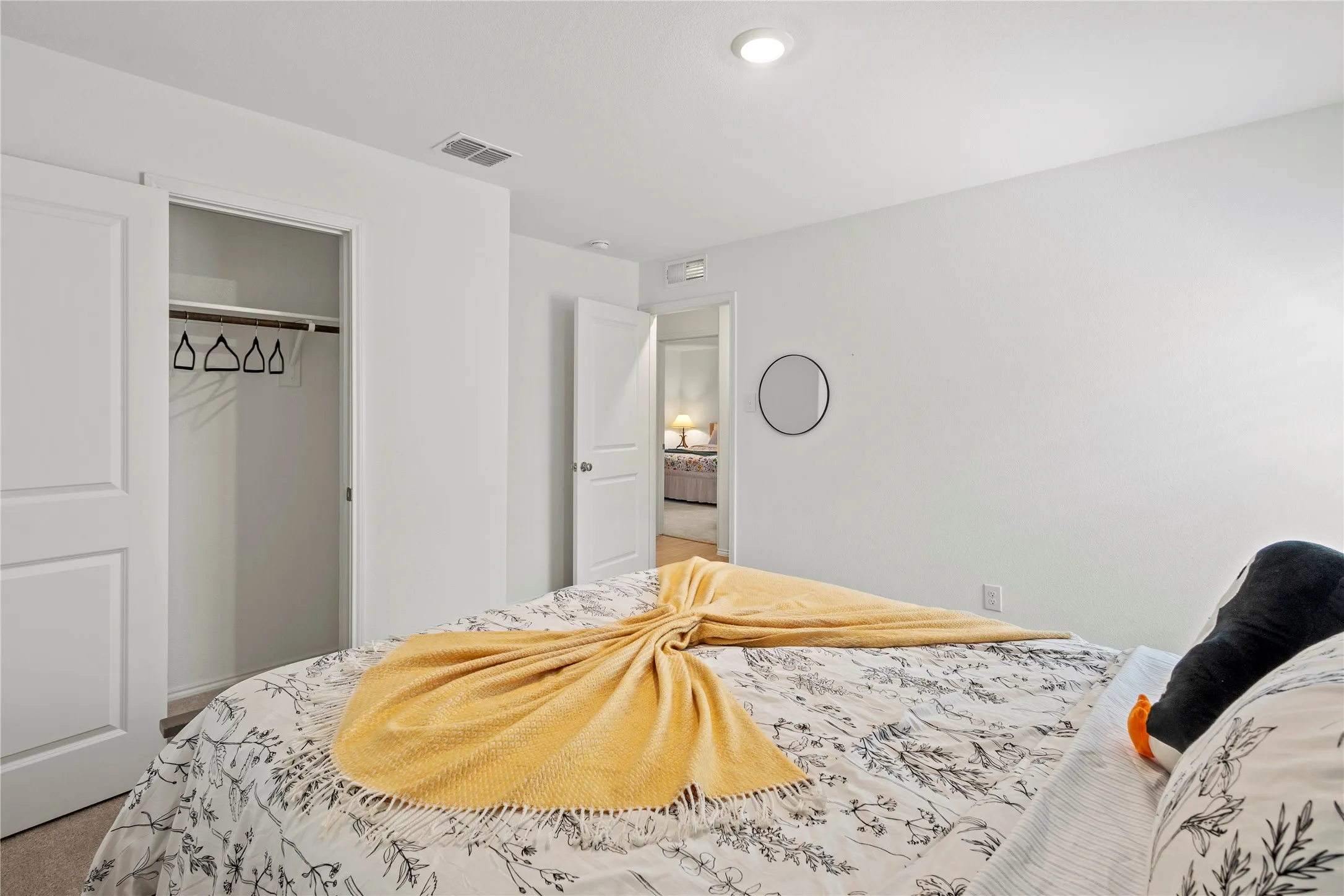 Neutral wall color, recessed ceiling lighting, and solid core doors
