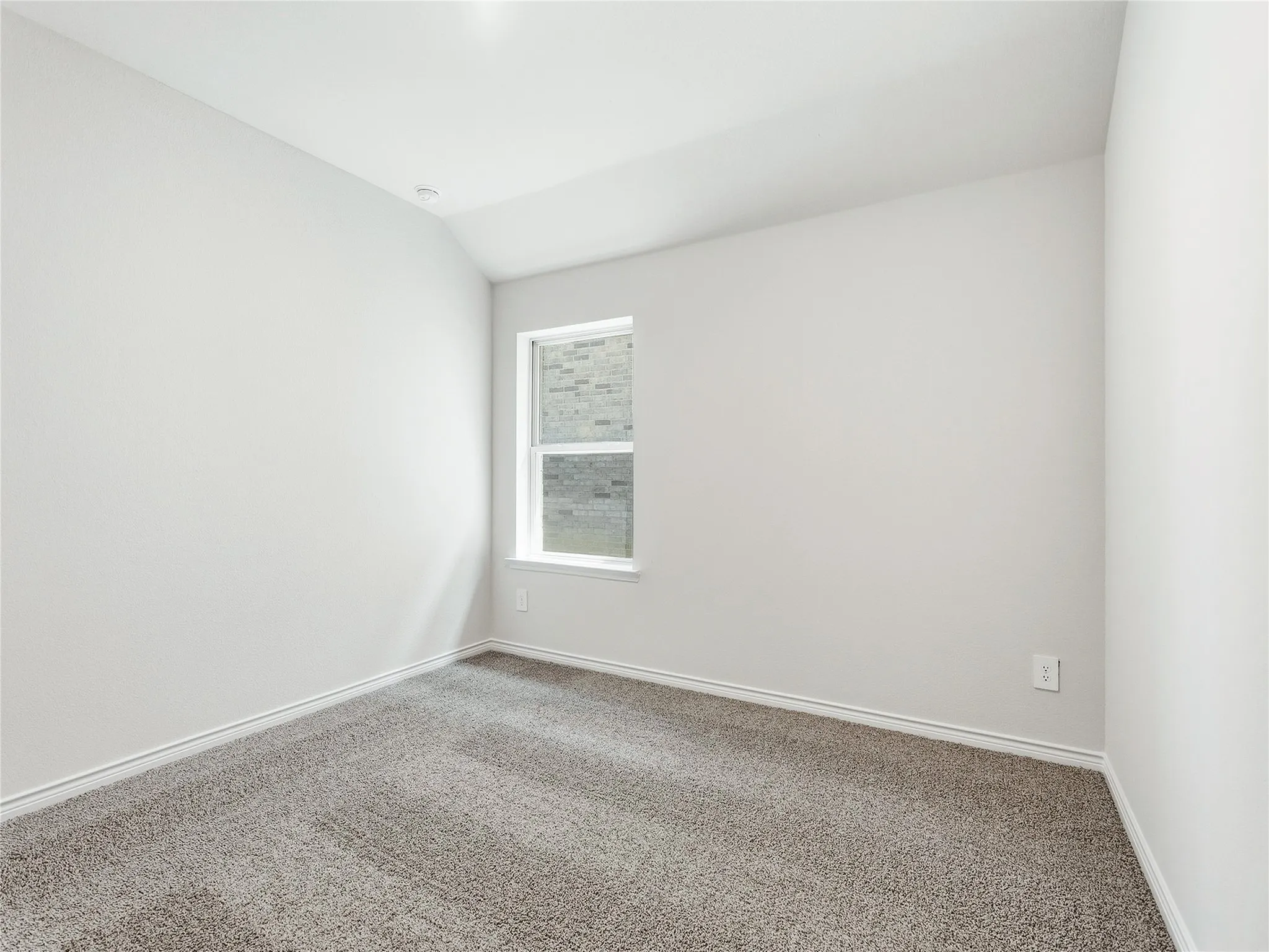 #3 Recessed ceiling lighting, vaulted ceiling, neutral wall finish, gray carpeting, and a single window