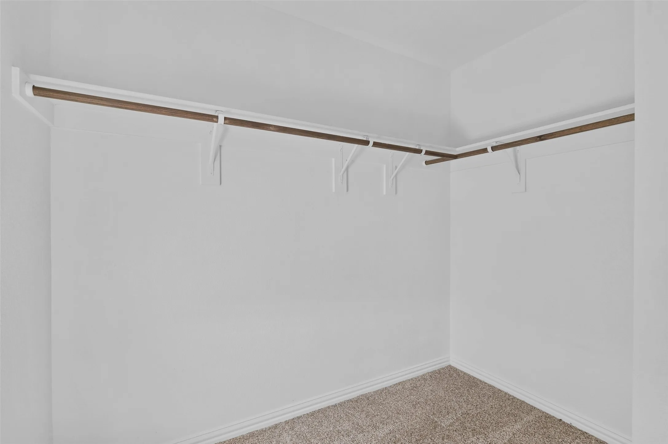 One of two walk in closets in the primary bedroom