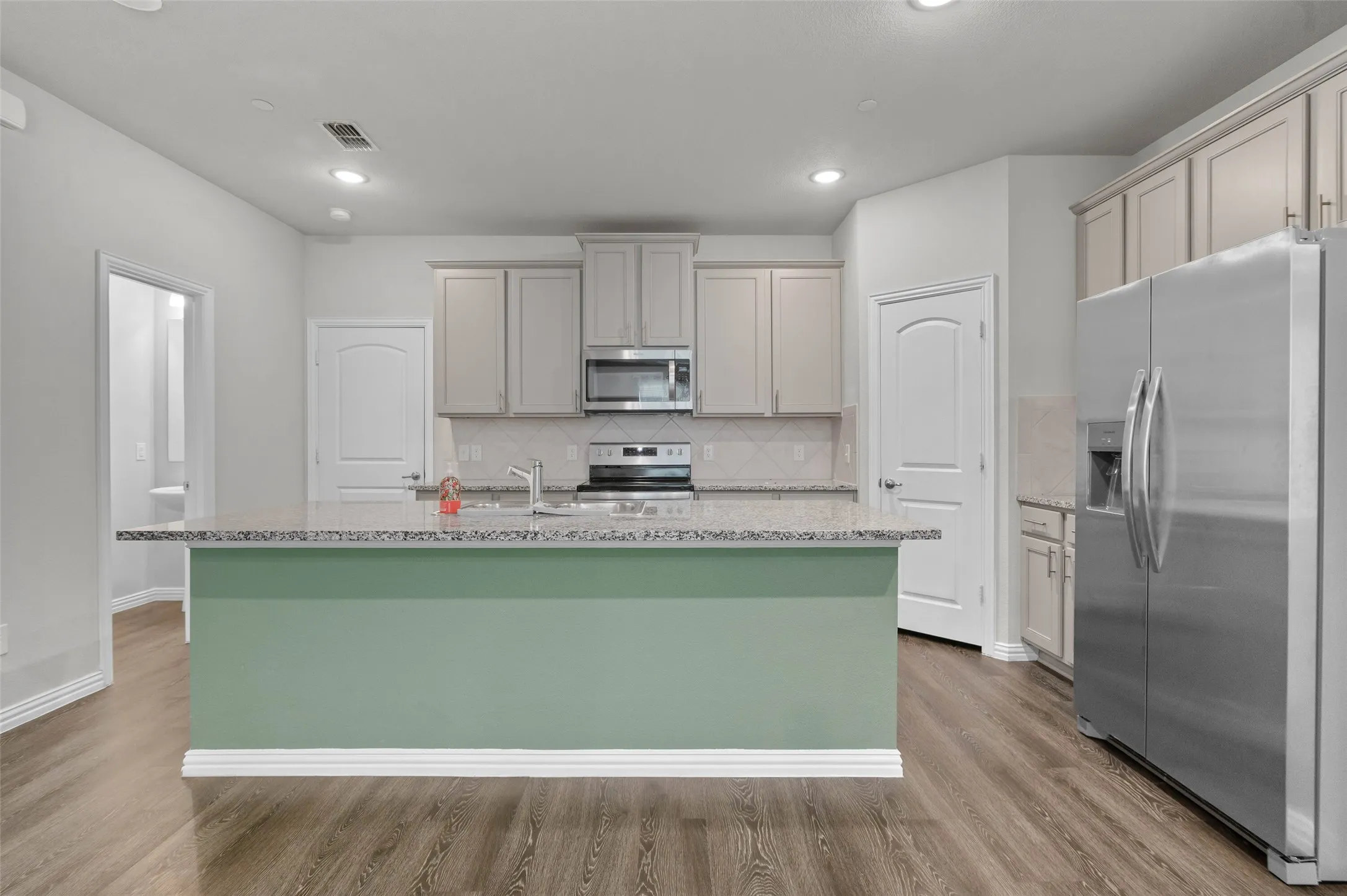 Kitchen with large island and breakfast bar