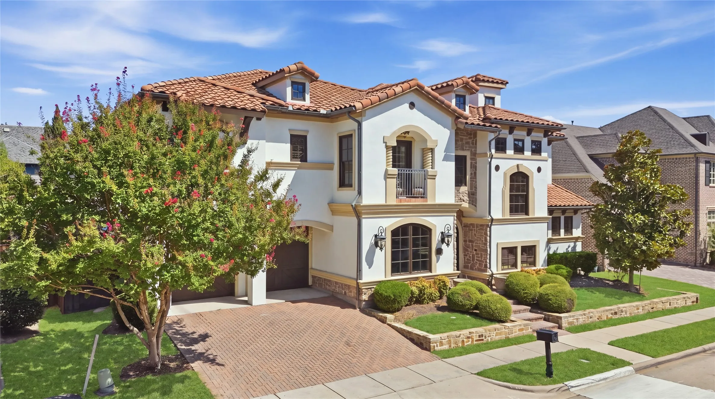 Mediterranean-inspired architecture with a red tile roof and stucco facade
