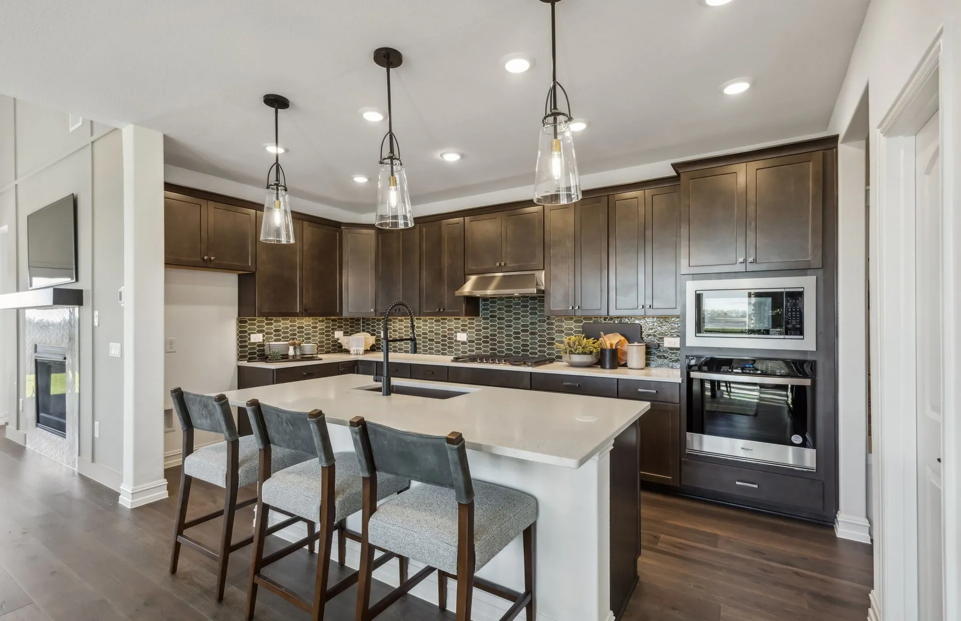 *Model Representation - Large island overlooking gathering room and dining areas