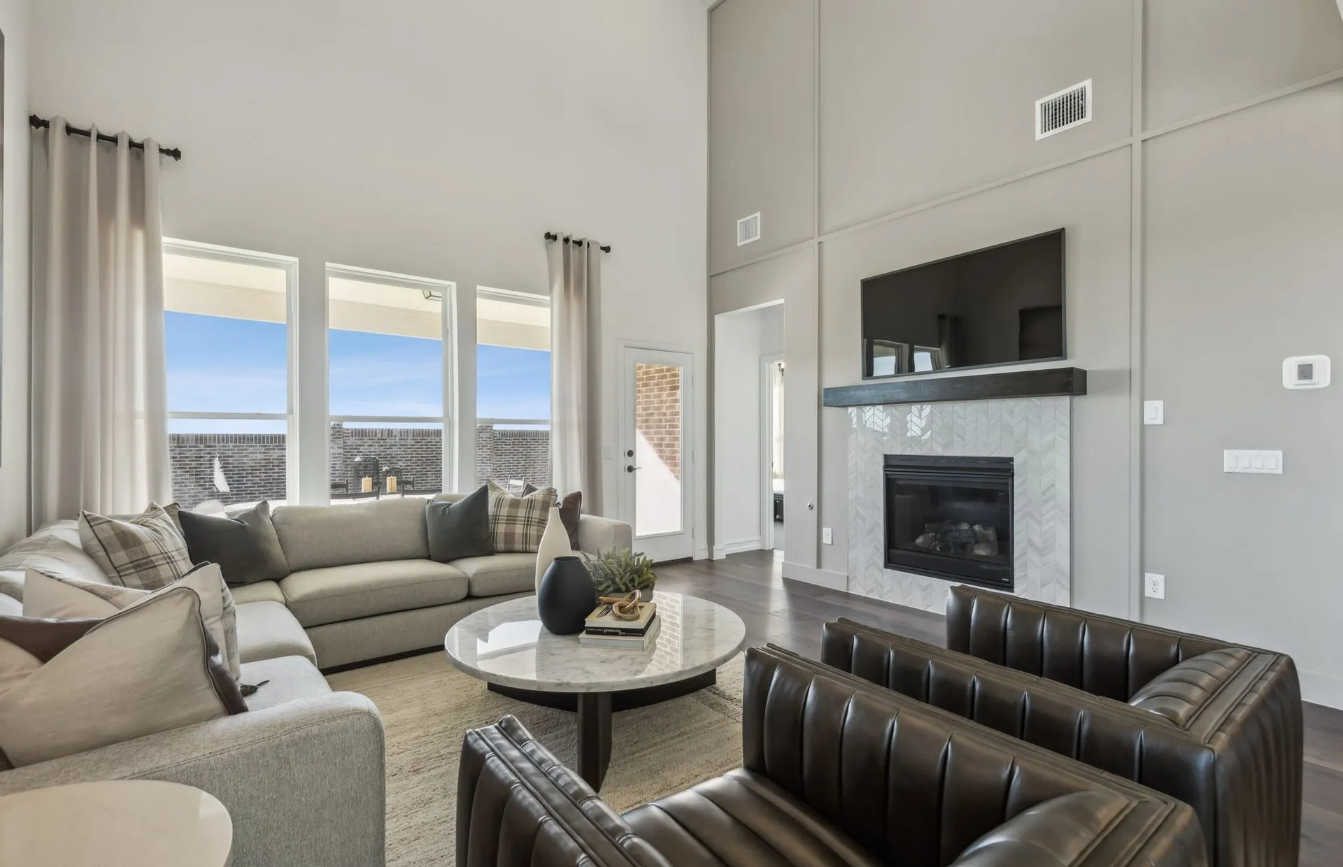 *Model Representation - Spacious gathering room with large windows
