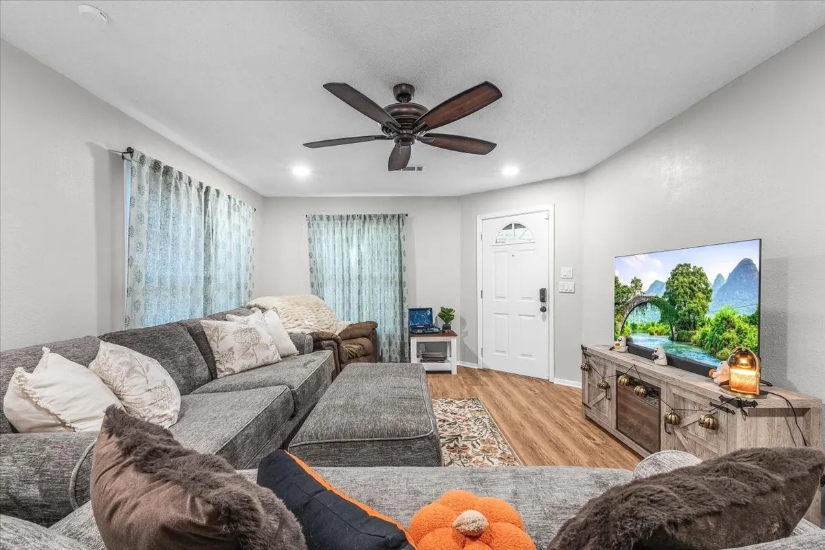 Wood-finish flooring throughout the space