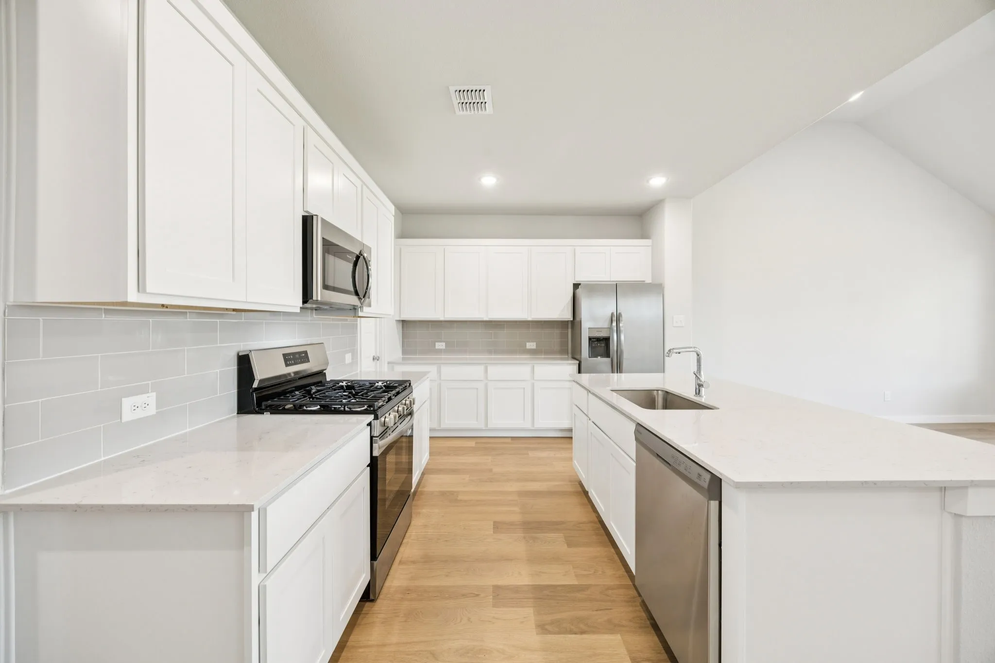 Kitchen in the Masters home plan by Trophy Signature Homes – REPRESENTATIVE PHOTO