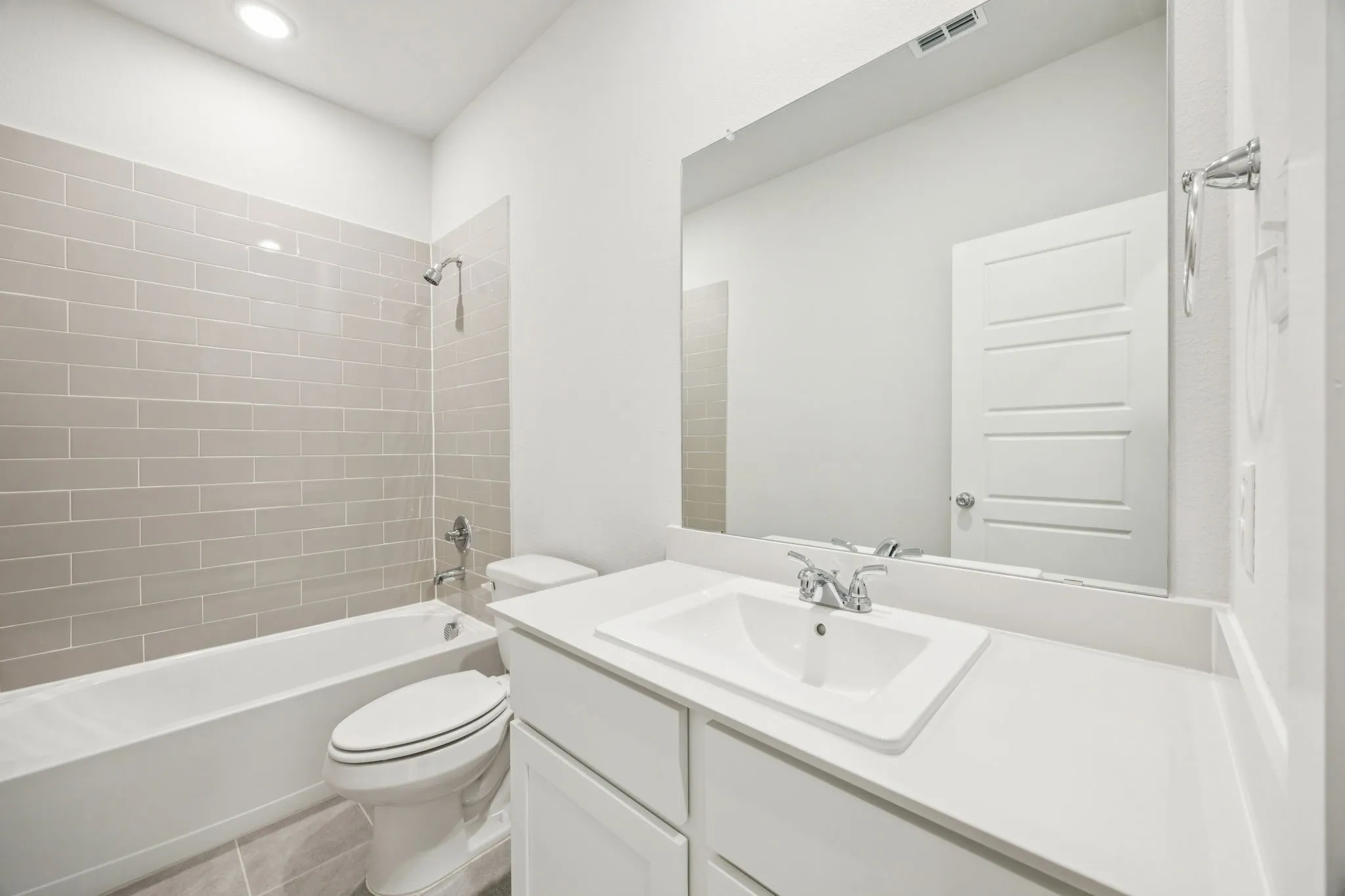 Bathroom in the Masters home plan by Trophy Signature Homes – REPRESENTATIVE PHOTO