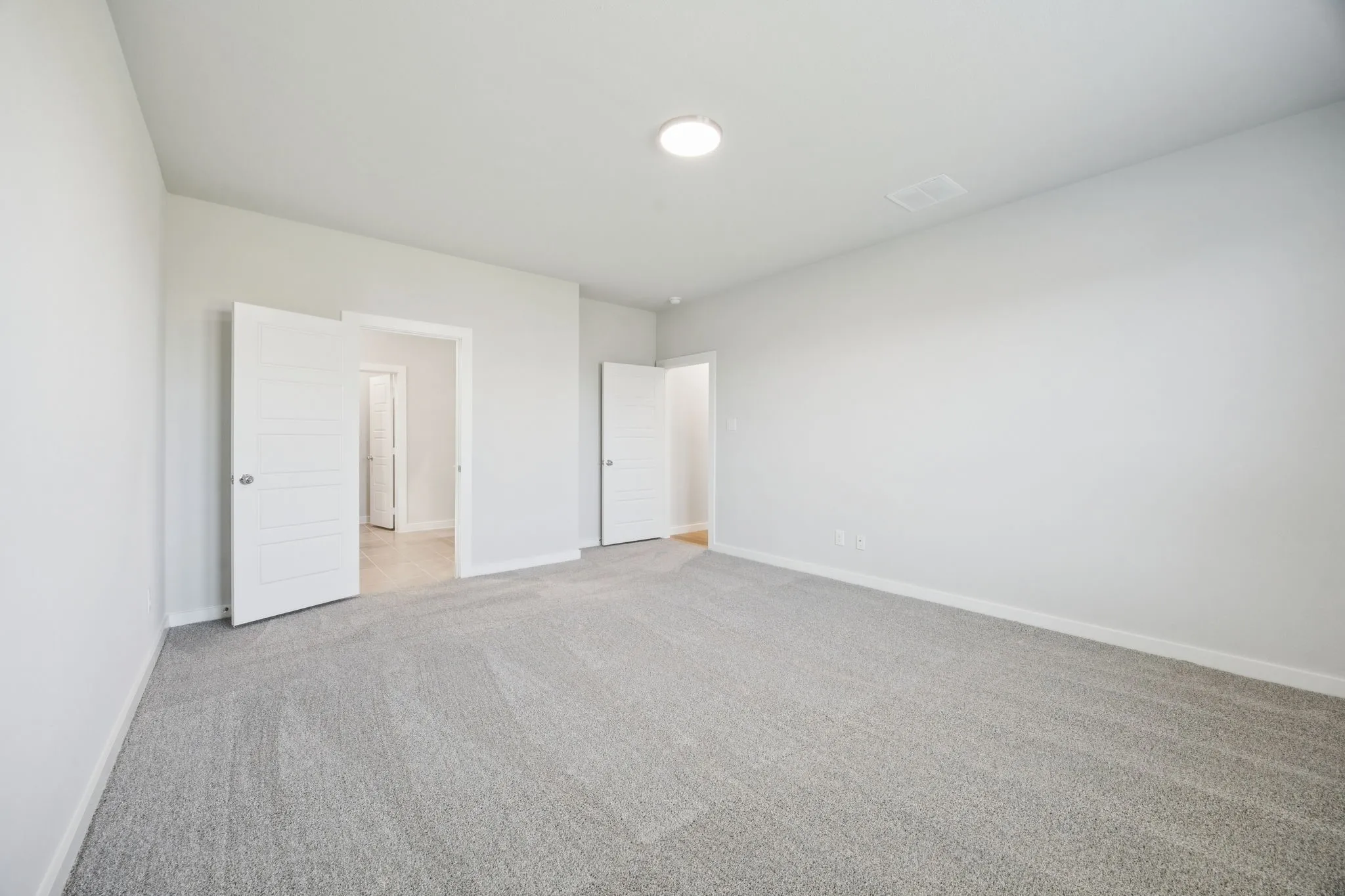 Primary Suite in the Masters home plan by Trophy Signature Homes – REPRESENTATIVE PHOTO