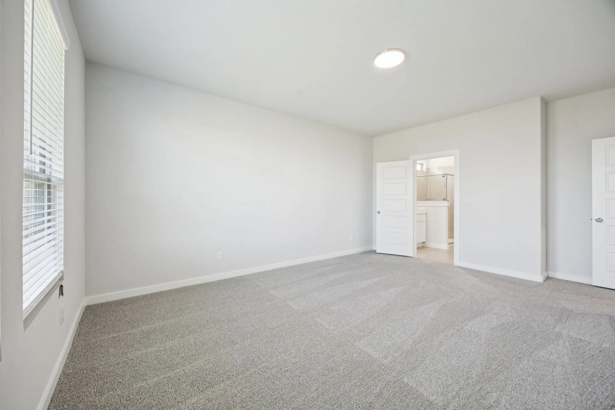Primary Suite in the Masters home plan by Trophy Signature Homes – REPRESENTATIVE PHOTO