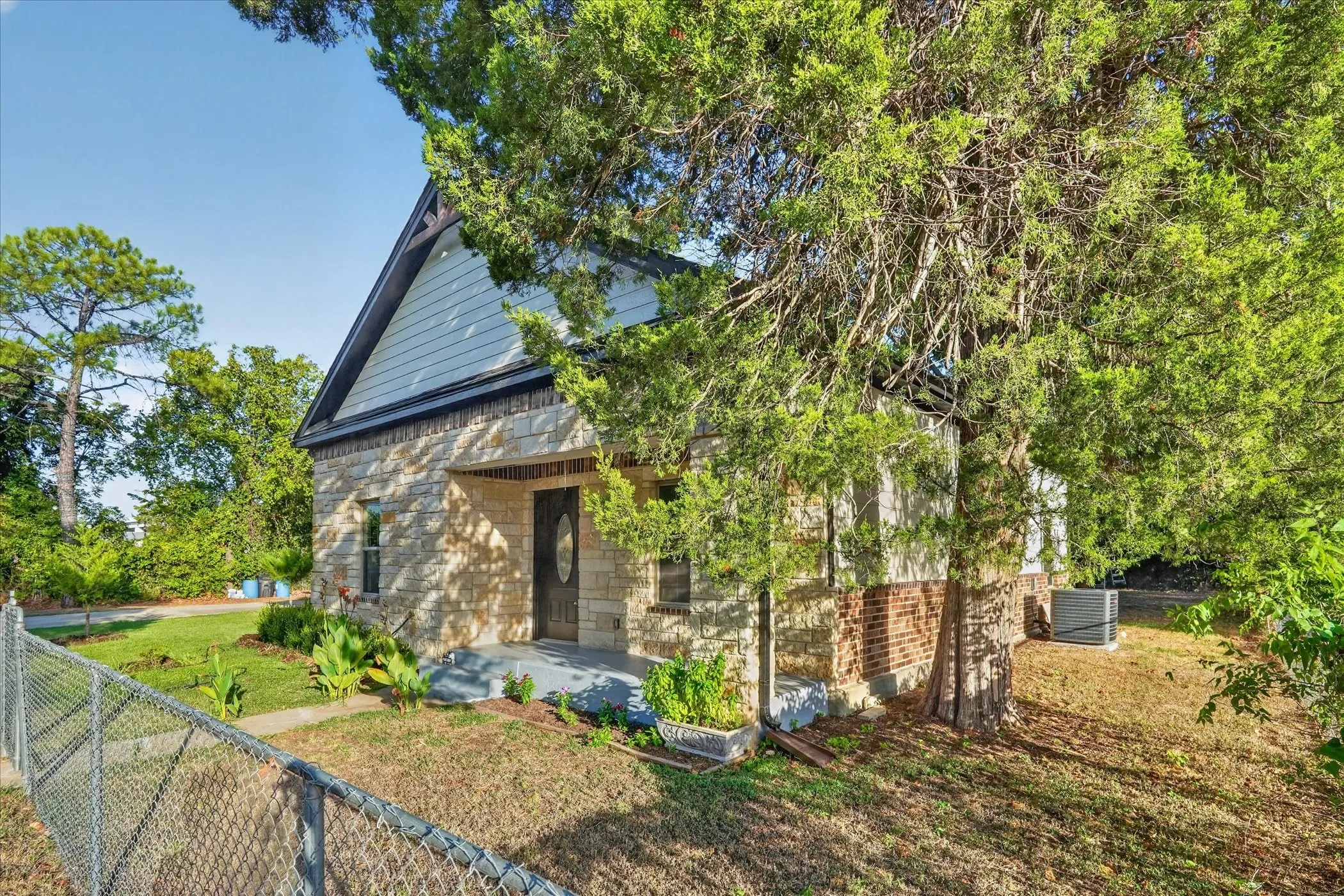 Stone and brick exterior with siding accents