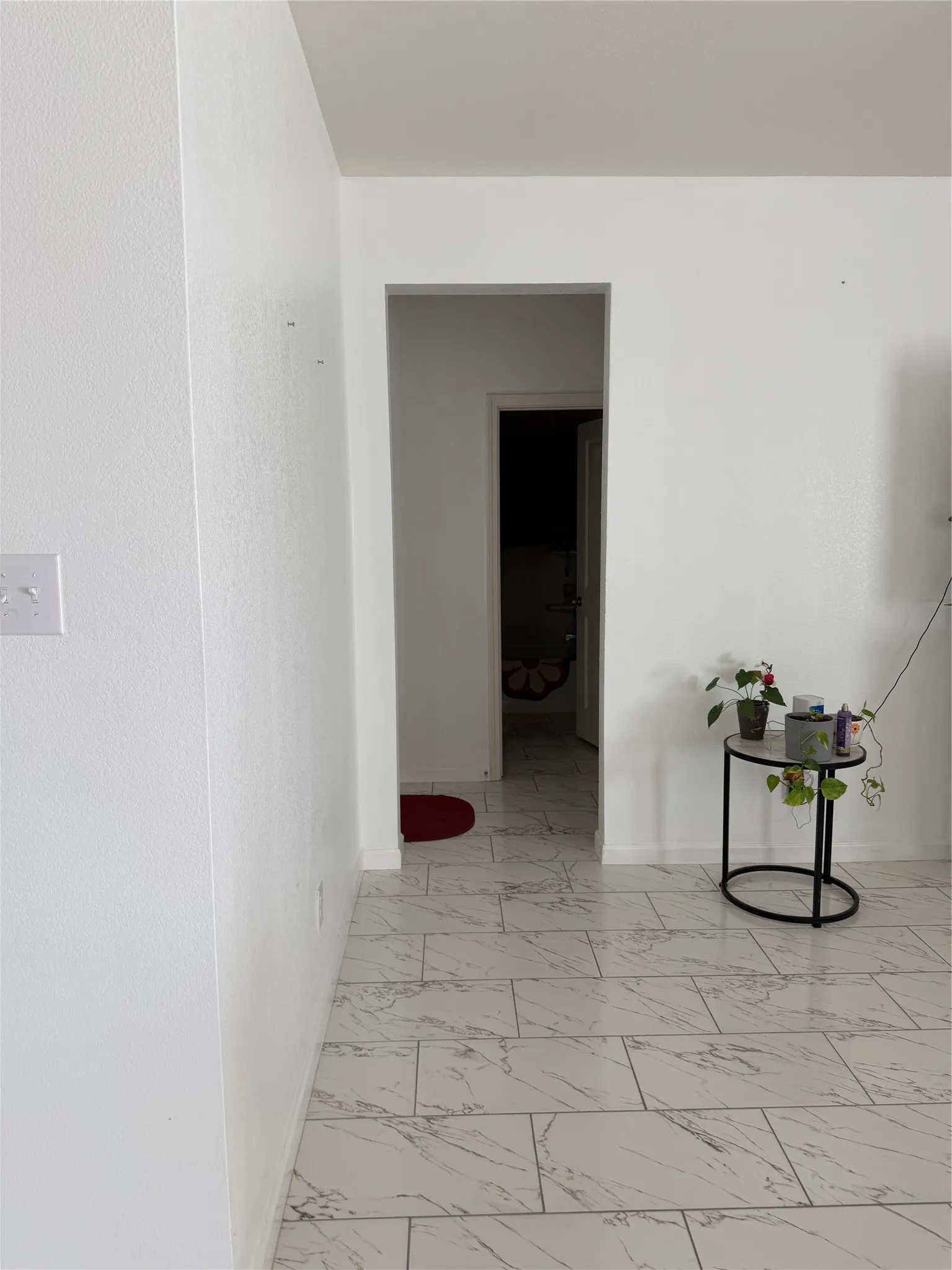 Rectangular floor tiles with a white and gray pattern