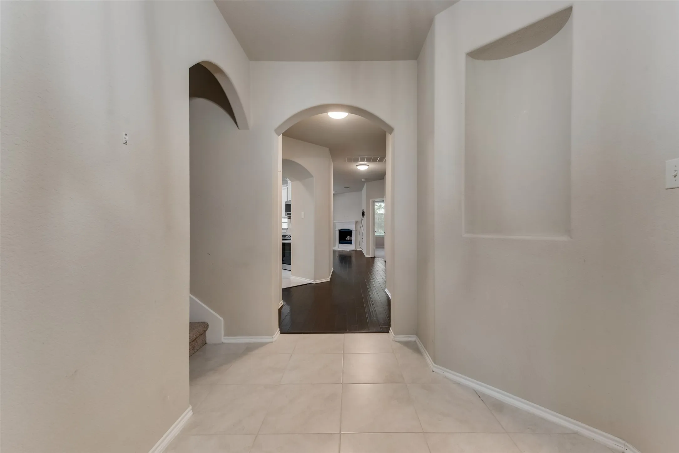 Hallway with light hardwood / wood-style floors