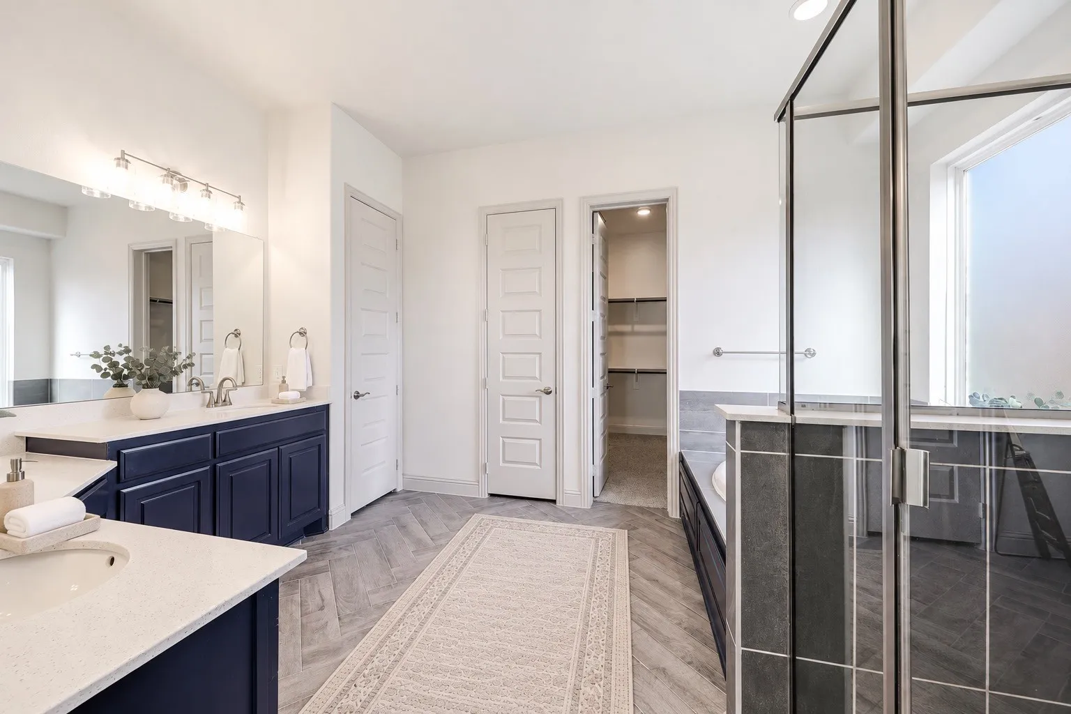 Dual sink vanity with dark wood-finish cabinetry and light-toned countertops -staging with AI