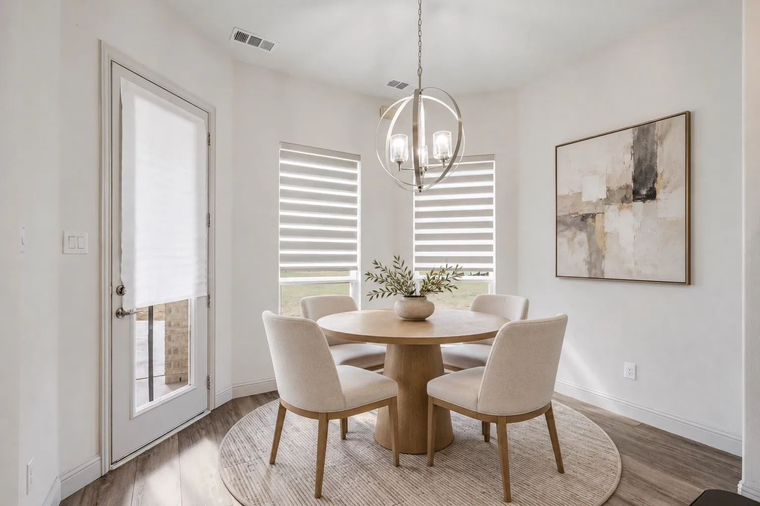 Wood-finish flooring, white walls, and a glass-paneled exterior door -staging with AI