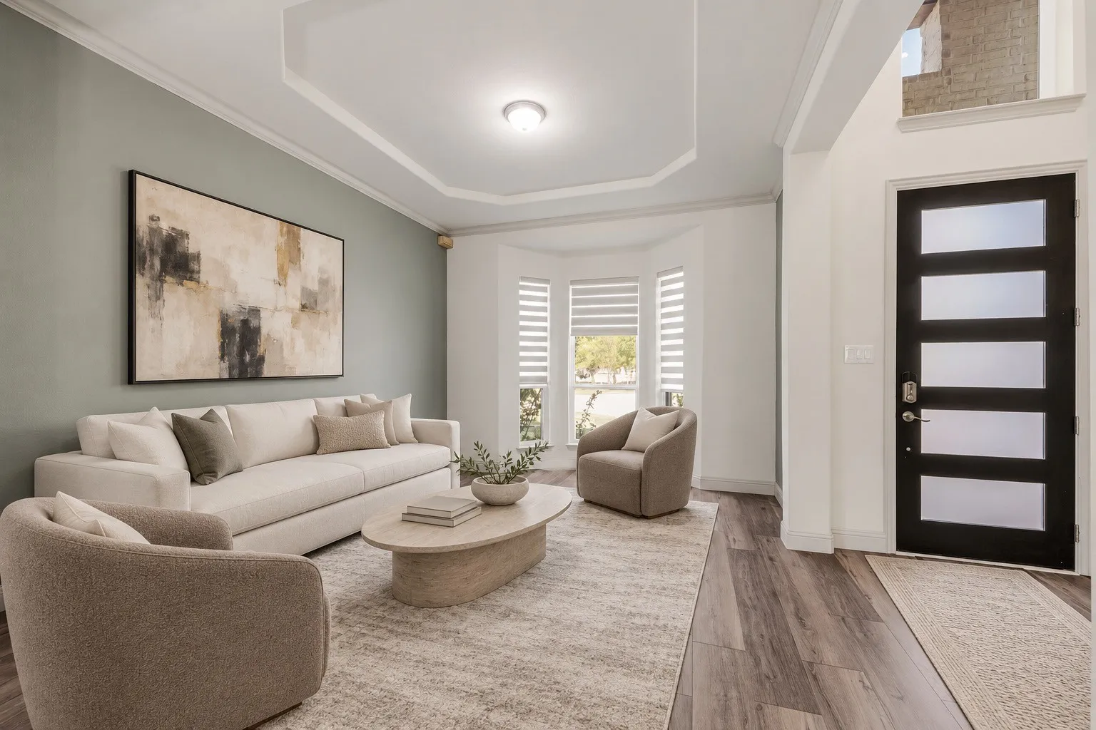 Tray ceiling, wood-finish flooring, bay window with blinds, modern entry door with opaque glass panels, and an interior wall with an accent color -staging with AI