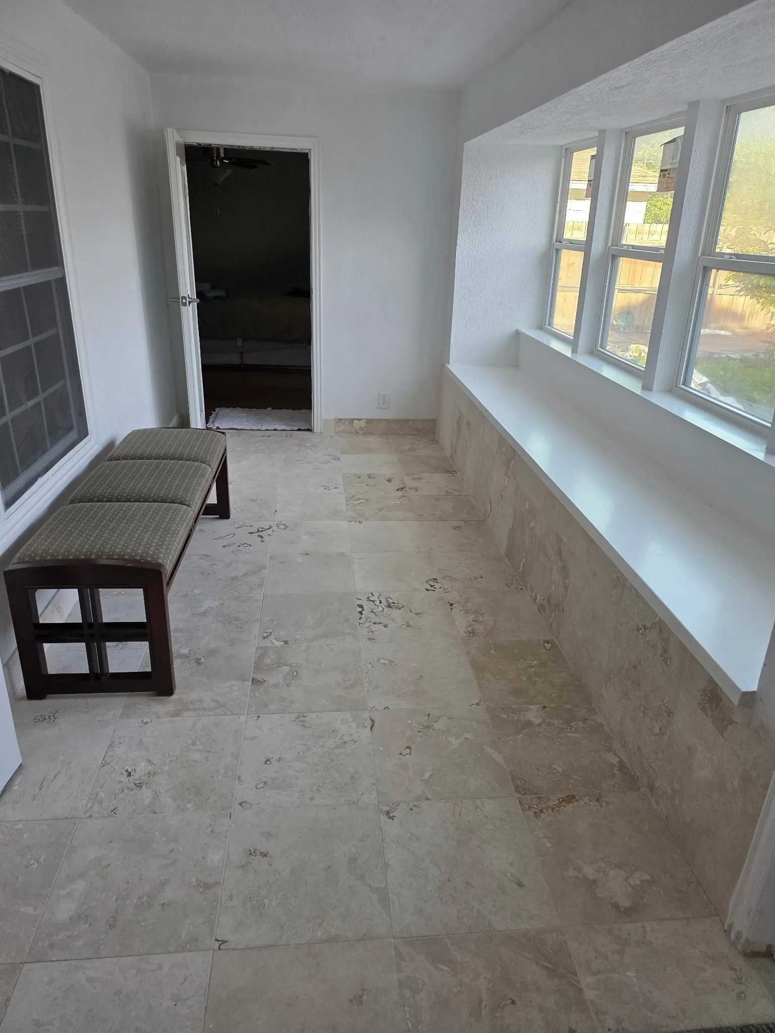 Hallway featuring stone finish floor