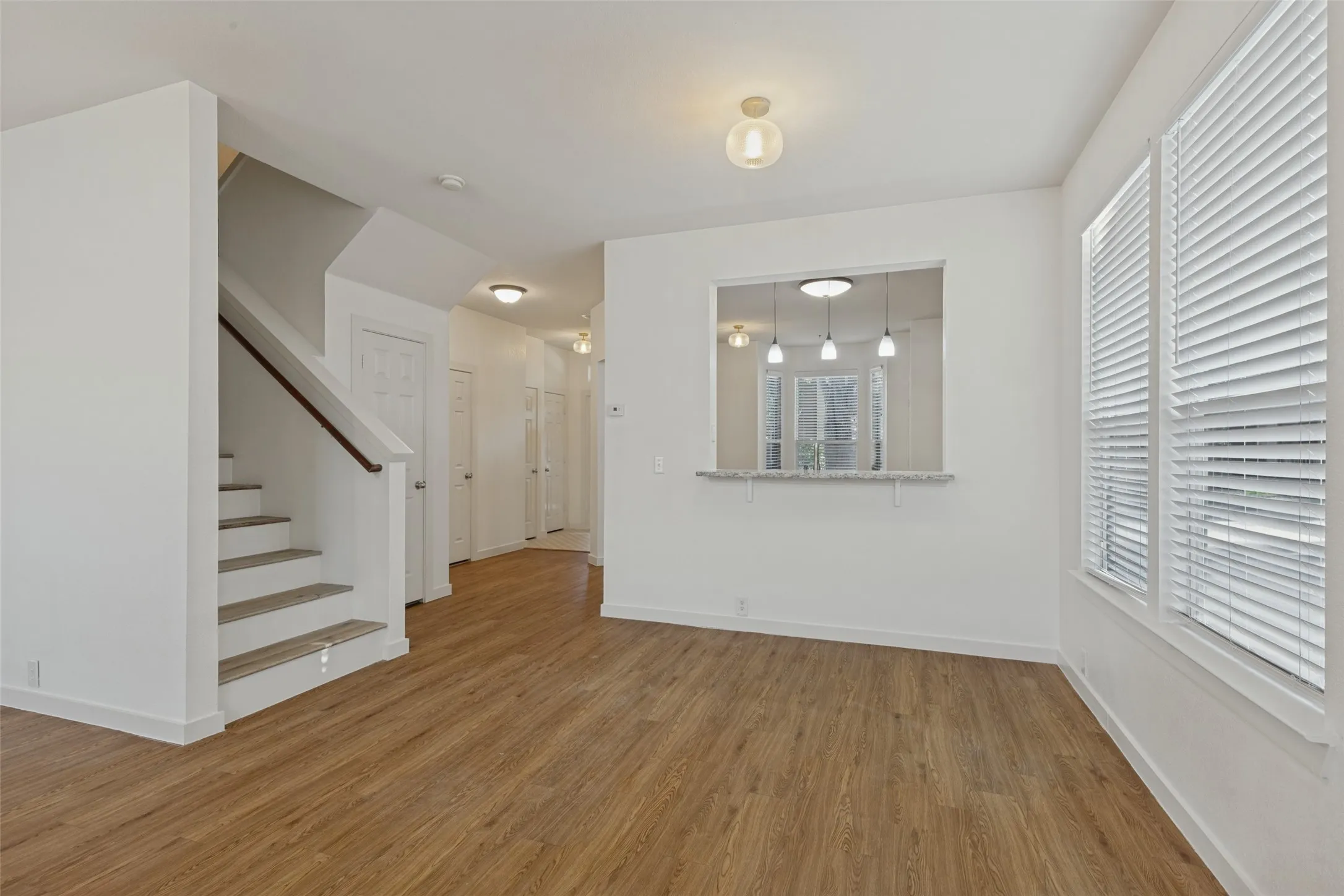 Window In Living Room with View into Kitchen