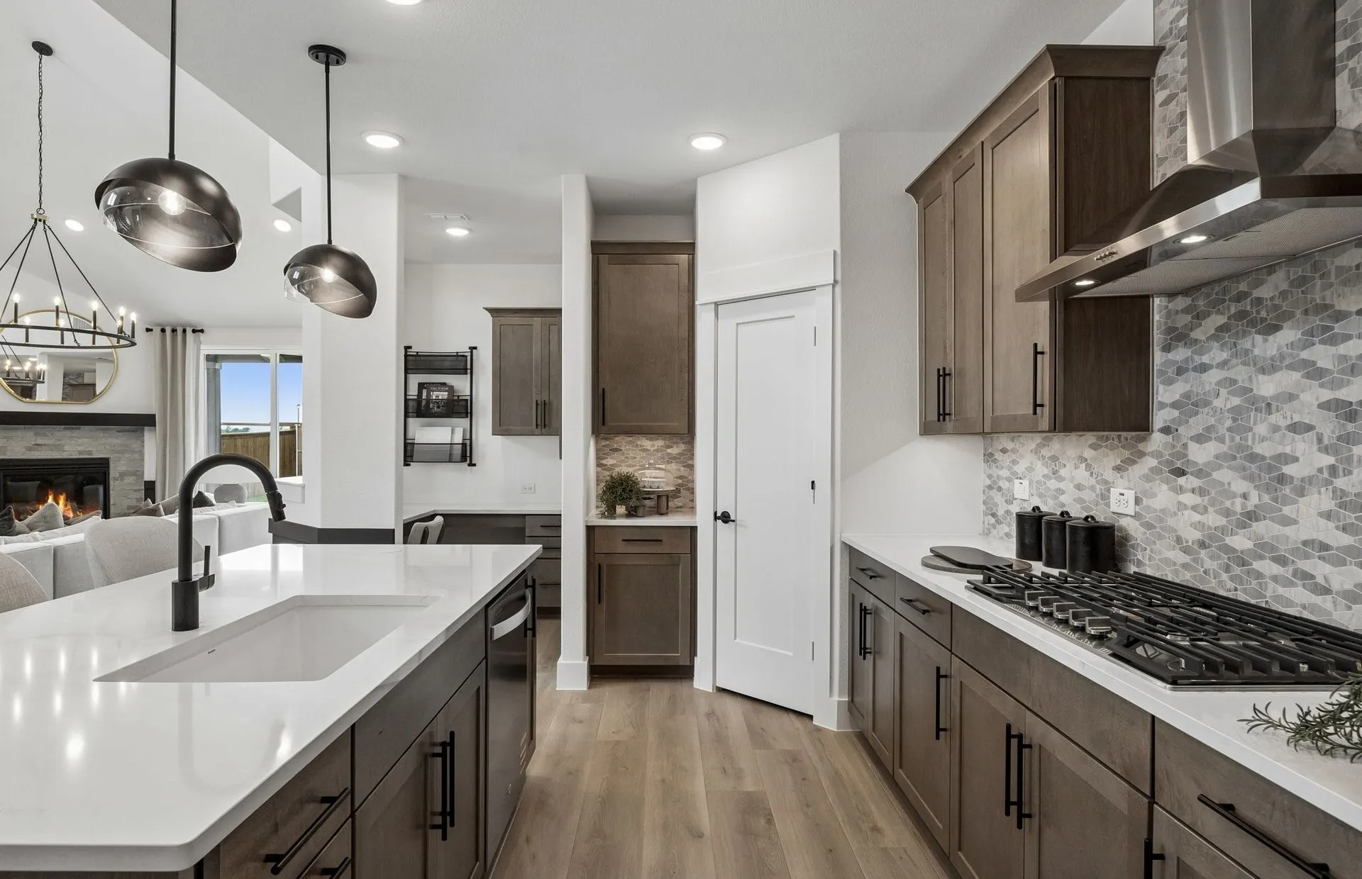 *Model Representation - Large island overlooking gathering room and dining areas
