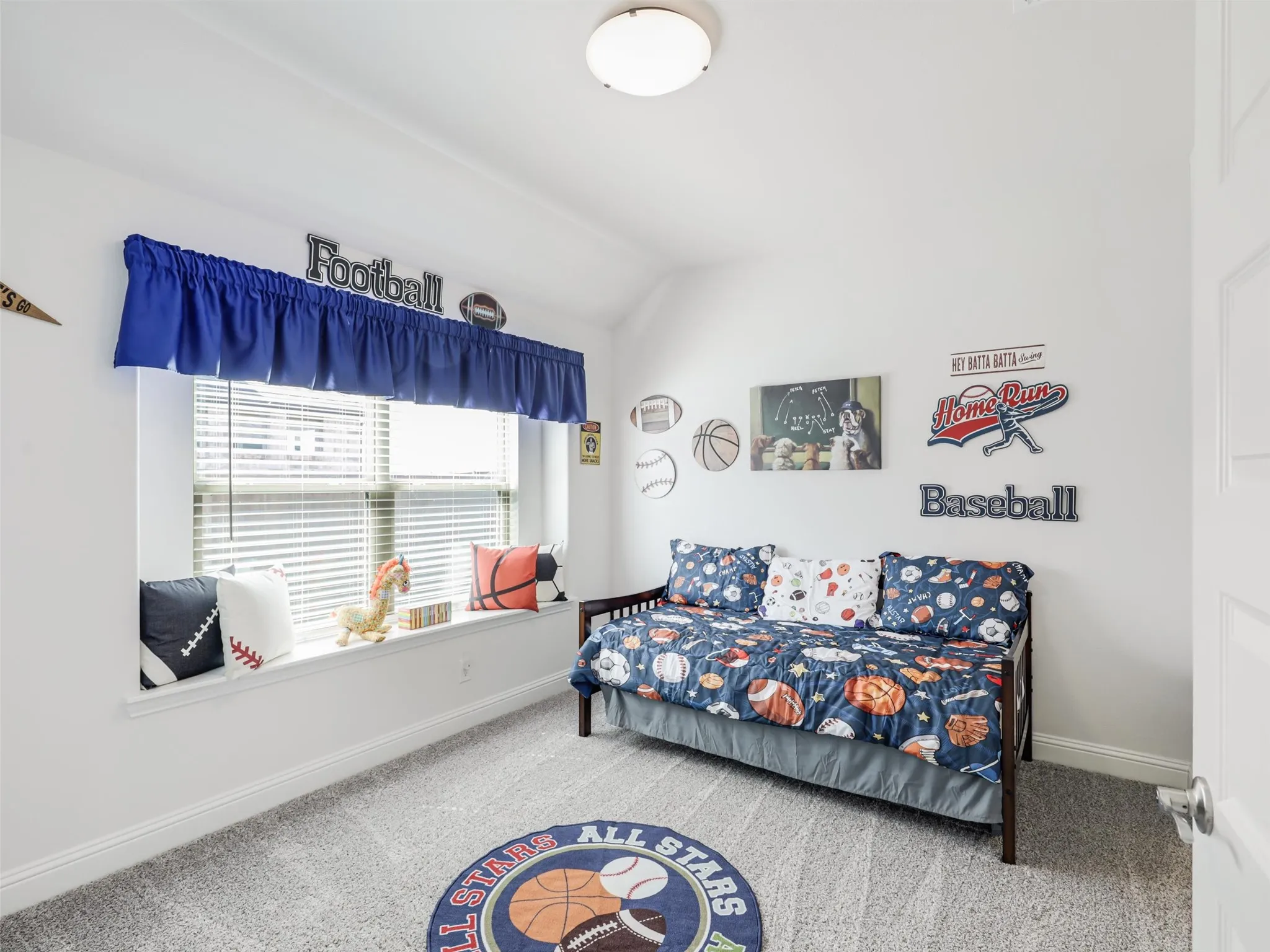 Recessed window with white blinds, neutral wall paint, and light-colored carpeting
