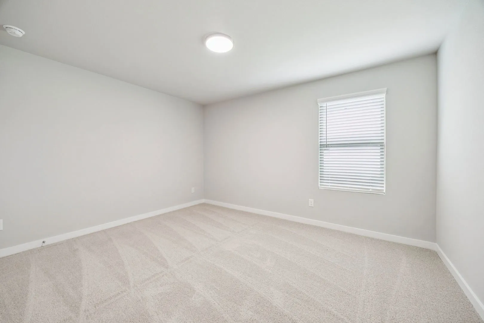 Bedroom in the Hayden home plan by Trophy Signature Homes – REPRESENTATIVE PHOTO