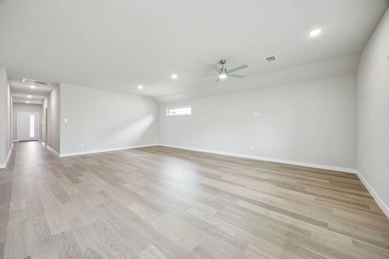 Dining and Living Room in the Hayden home plan by Trophy Signature Homes – REPRESENTATIVE PHOTO